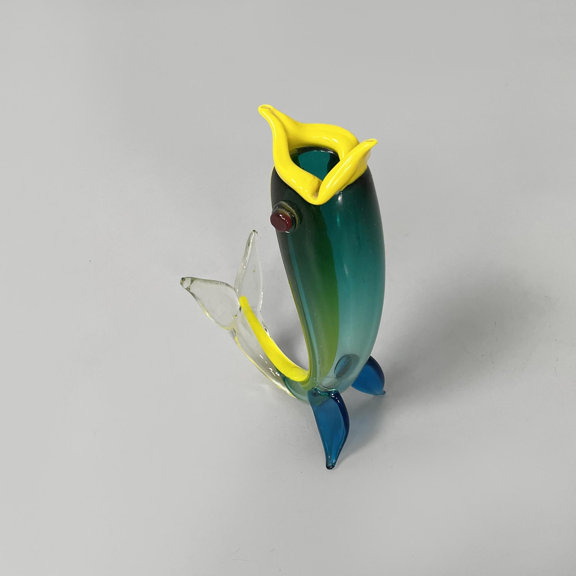 Italian modern Murano glass fish sculpture by Fulvio Bianconi for Venini, 1990s
Fantastic and vintage fish-shaped sculpture, entirely made of Murano glass. The open mouth is yellow, while the body is green and blue with a decorative yellow line. The