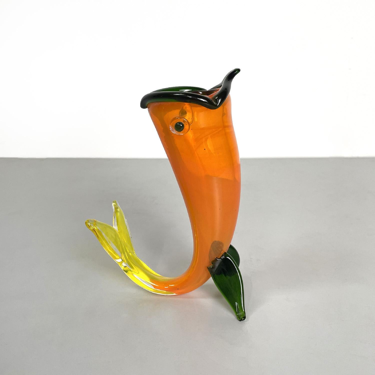 Italian modern Murano orange yellow and green fish vase by Venini, 1990s
Venini fish-shaped vase in Murano glass. The vase rests on the fins and tail of the fish, in the upper part it has a hole that represents the open mouth. The colors of the