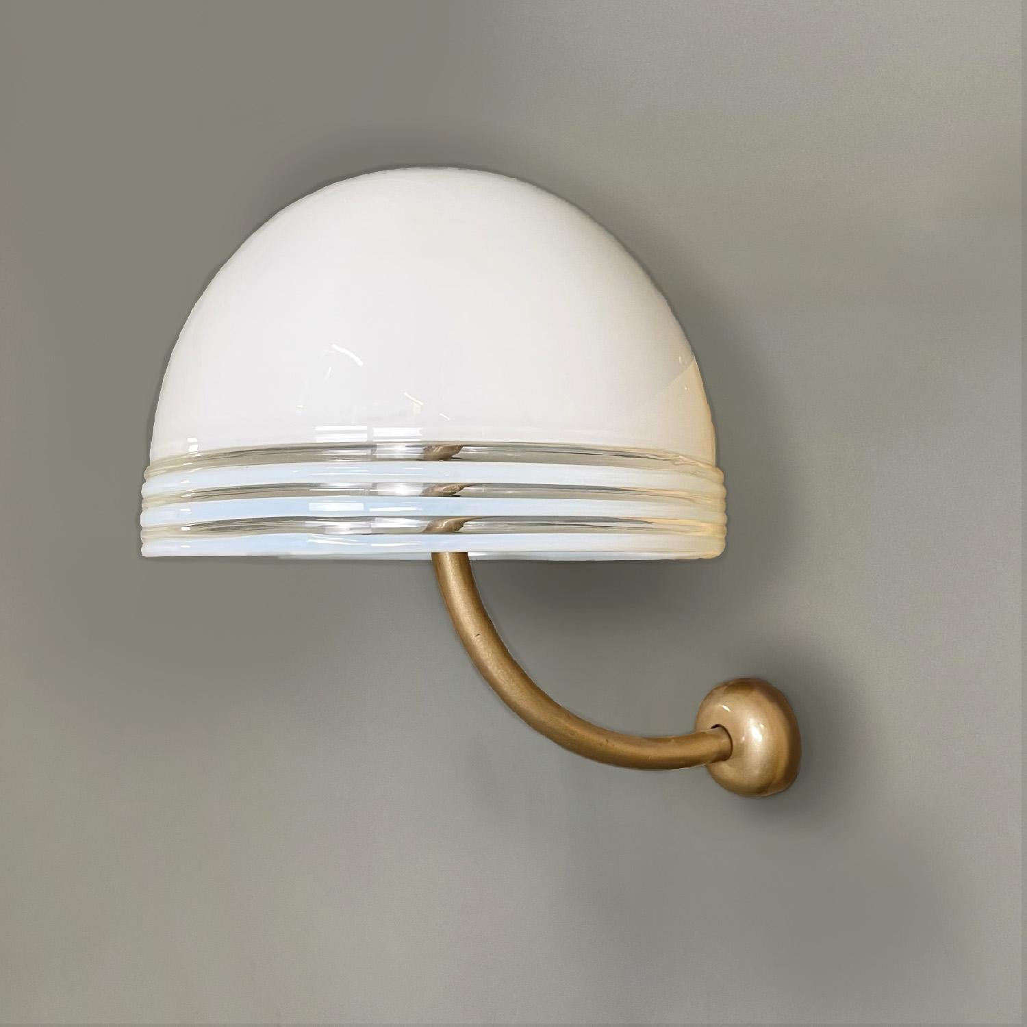 Italian modern Murano white glass and golden metal appliques by Leucos, 1980s

Set of three round base wall sconces. The diffuser is a hemisphere in white Murano glass, at the edges there are three decorative lines in transparent glass. The support