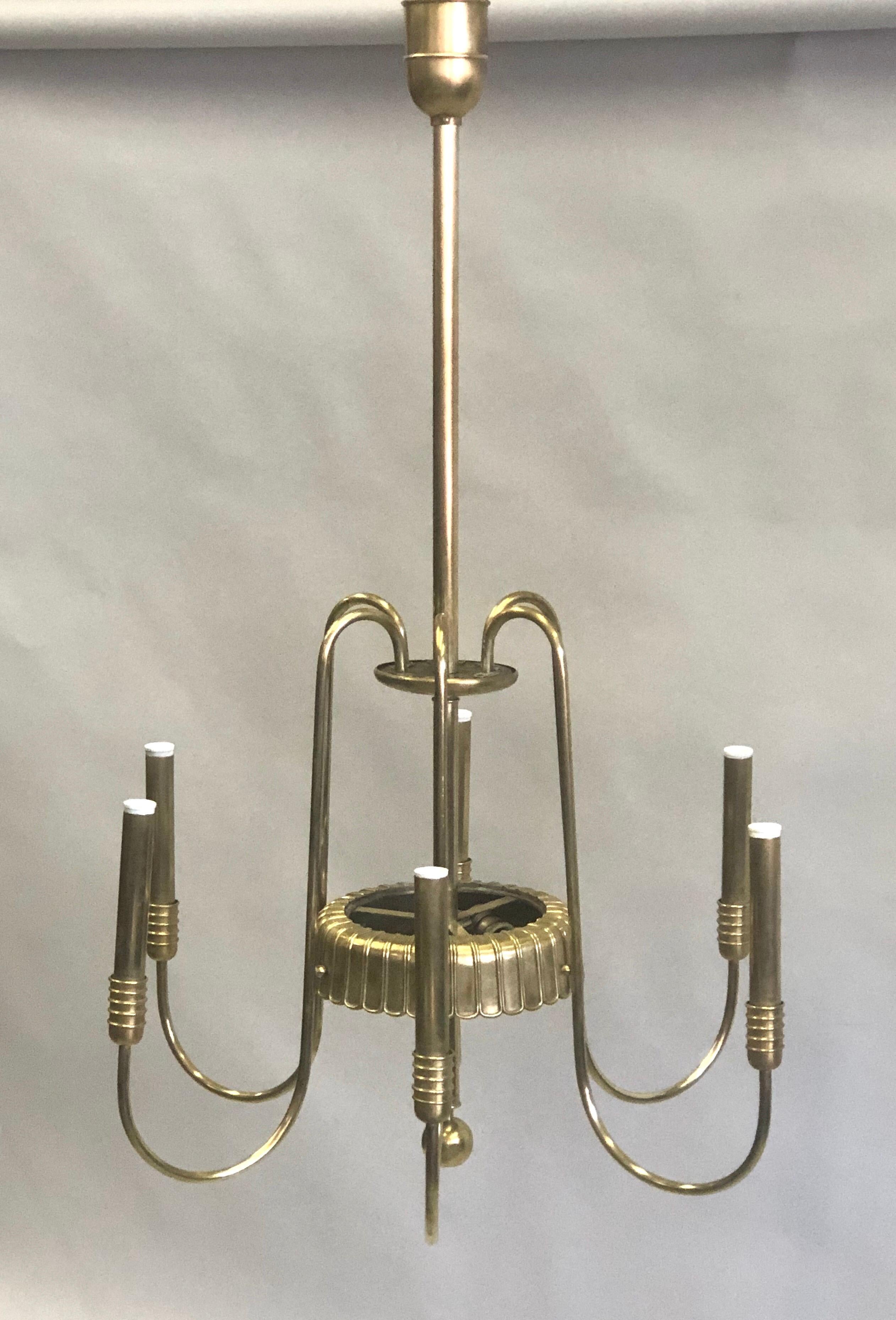 Elegant and timeless Italian Mid-Century Modern neoclassical / Art Deco chandelier in naturally antiqued solid brass designed by Luigi Brusotti for the manufacturer, Fontana Arte. The pieces has simple, pure lines that is contrasted with raised