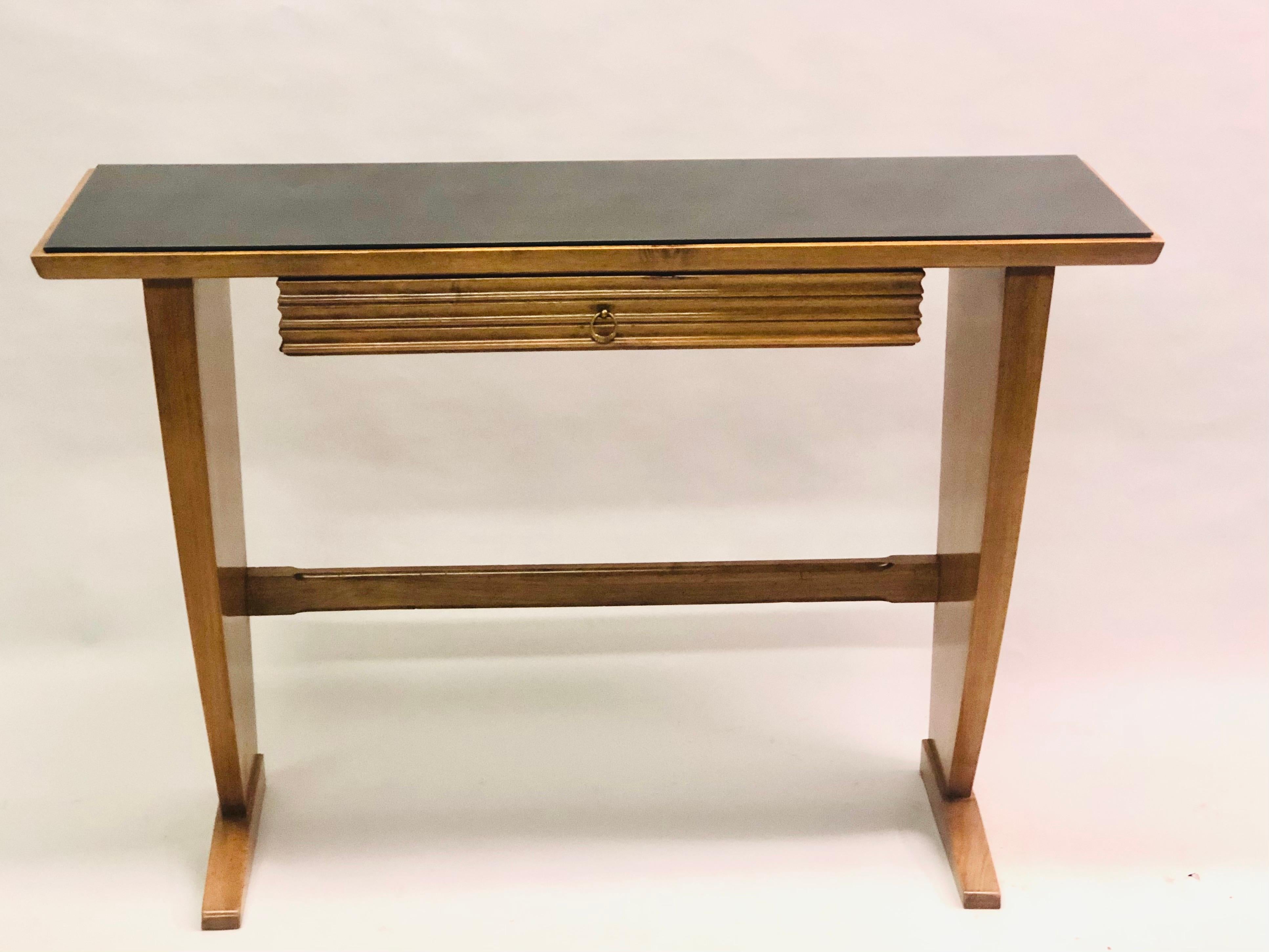 An exceptional Italian Mid-Century Modern Neoclassical Walnut Wood and Black Onyx glass console or writing table attributed to Paolo Buffa circa 1950. 

The console has a beautiful balance of materials with the light wood contrasting perfectly with