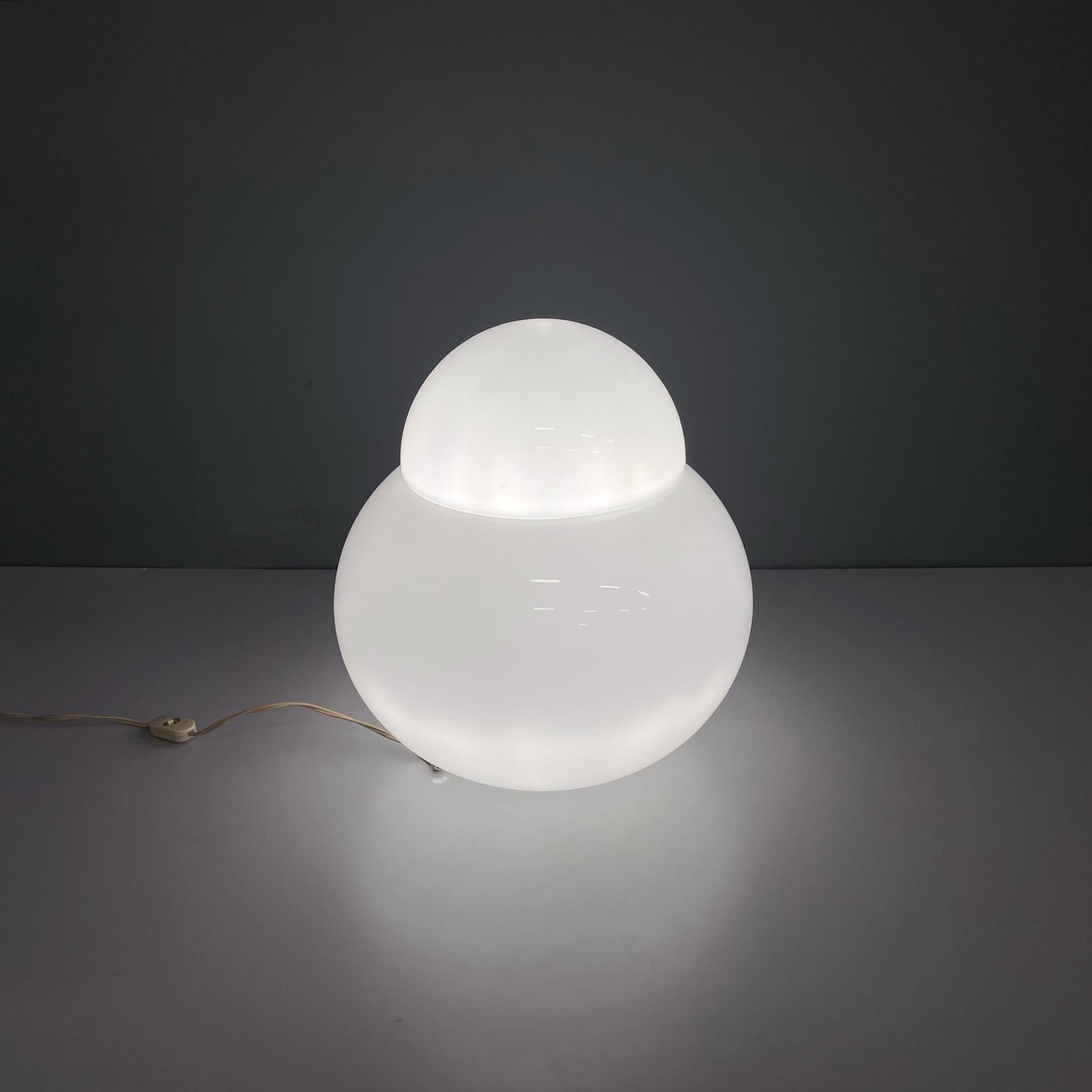 Italian modern Opaline glass Table lamp Daruma by Asti for Fontana Arte, 1970s
Table lamp mod. Daruma with round base. The rounded structure of the diffuser is made up of two hemispherical parts in hand-blown opaline glass.
Produced by Fontana