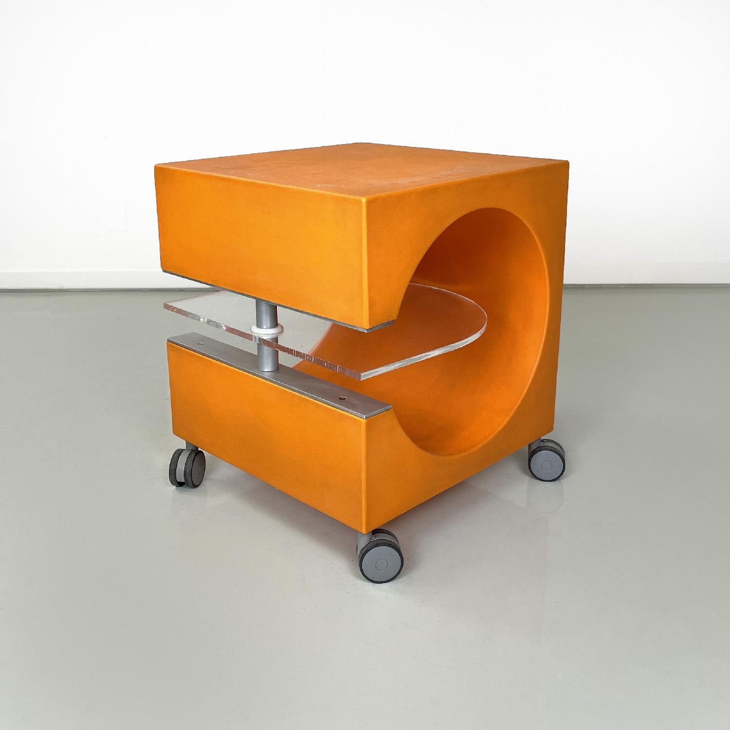 Italian modern orange plastic coffee table with plexiglass clear top, 2000s
Coffee table or bedside table with square top. The structure is made of rough orange plastic, in the central part there is a circular opening where in the middle there is a