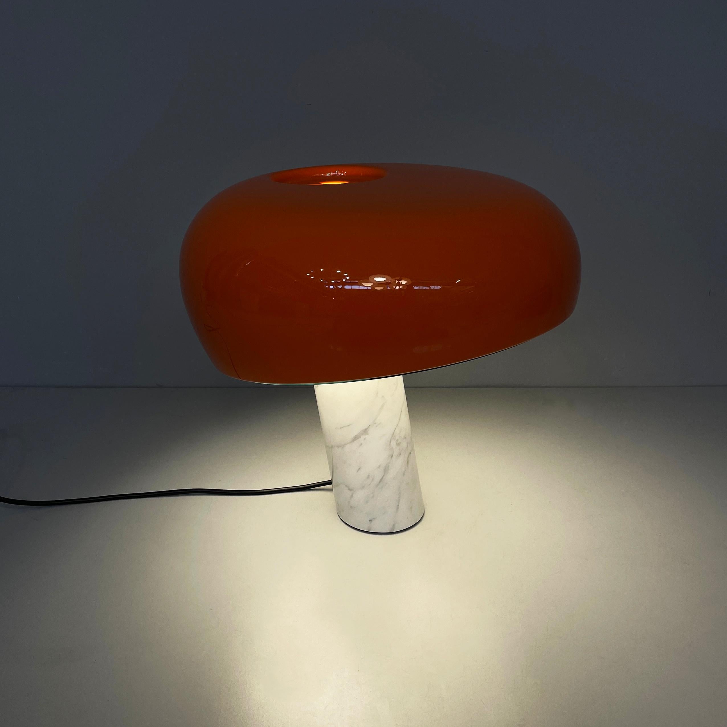 Italian modern orange table lamp Snoopy by Achille and Pier Giacomo Castiglioni for Flos, 2020
Iconic table lamp mod. Snoopy with rounded diffuser in orange lacquered metal with a glossy finish. The diffuser has 3 holes at the top and a transparent