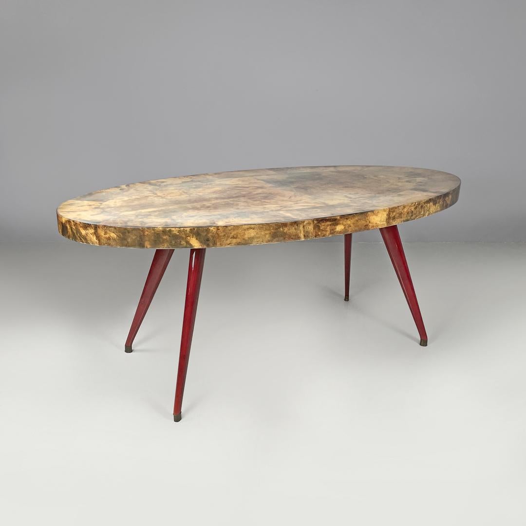 Table de salle à manger italienne moderne ovale en parchemin avec pieds en bois laqué rouge 1970
Table de salle à manger avec plateau ovale recouvert de parchemin, finition brillante. Il possède quatre pieds en bois laqué rouge qui se développent