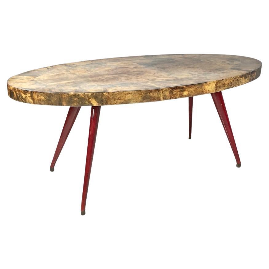 Tavolo da pranzo ovale moderno italiano in pergamena con gambe in legno laccato rosso anni '70