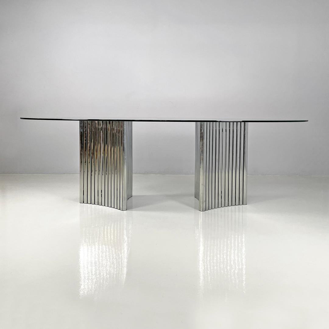 Modern Italian modern oval glass top dining table with chromed metal columns, 1970s