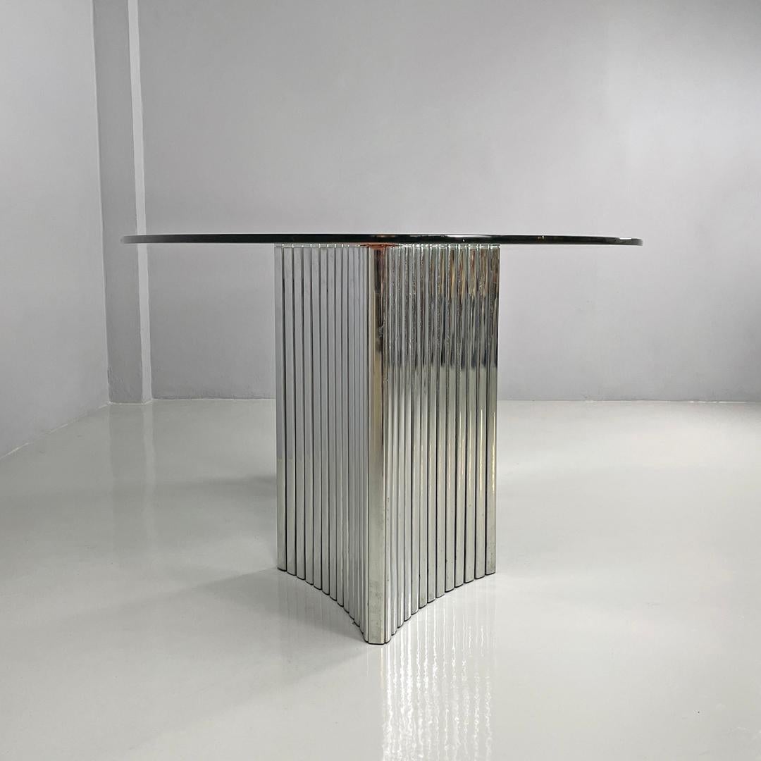 Late 20th Century Italian modern oval glass top dining table with chromed metal columns, 1970s