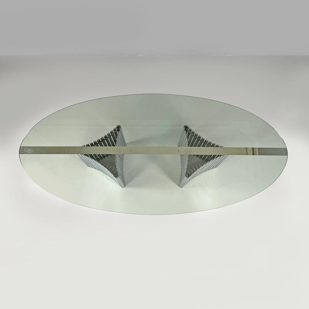 Italian modern oval glass top dining table with chromed metal columns, 1970s 1