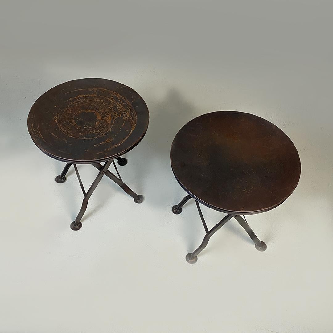 Italian modern pair of iron folding stools or coffee tables, 1980s.
Pair of industrial and strong presence iron stools or coffee tables, with round top with grooved edge and folding leg with round-shaped end tips.
1980 Approx.
Good general