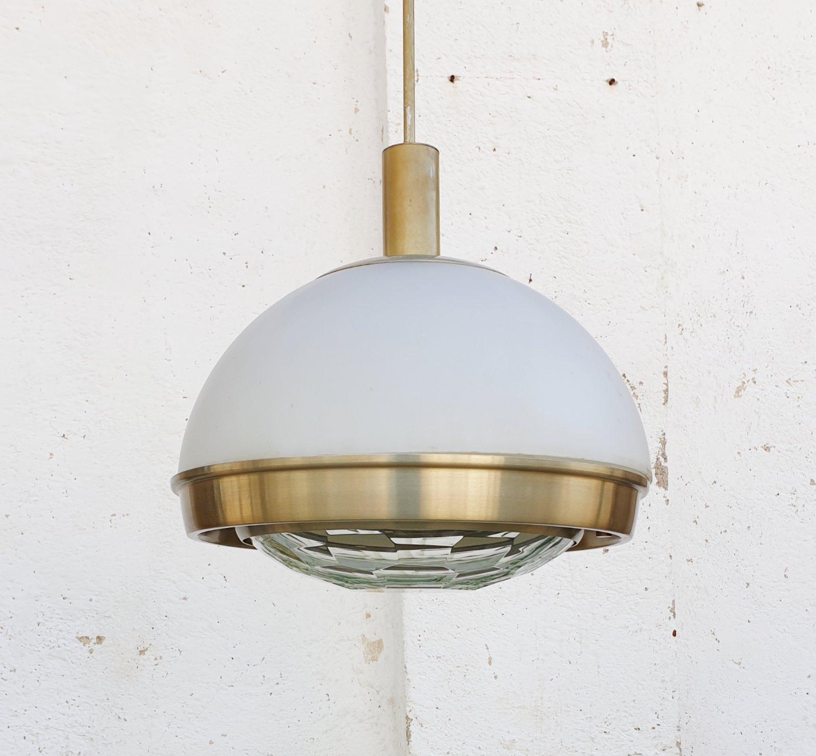 Rare ceiling lamp designed by Pia Giudetti Crippa for Lumi Milano
In perfect working conditions.
This suspension lamp in brushed gold aluminum, upper diffuser in satin glass and lower diffuser in thick transparent faceted glass. 