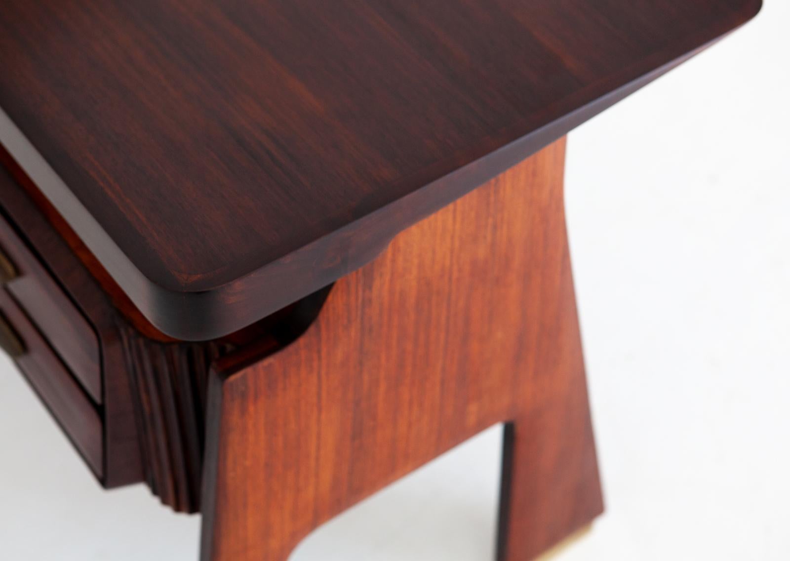 A small day desk that is made of sculptural rosewood base with two drawers and brass handles and feet’s.
The ultra modern but soft lines, the lightness of the design, the incredible handwork of the drawer make this object unique in its kind.

The