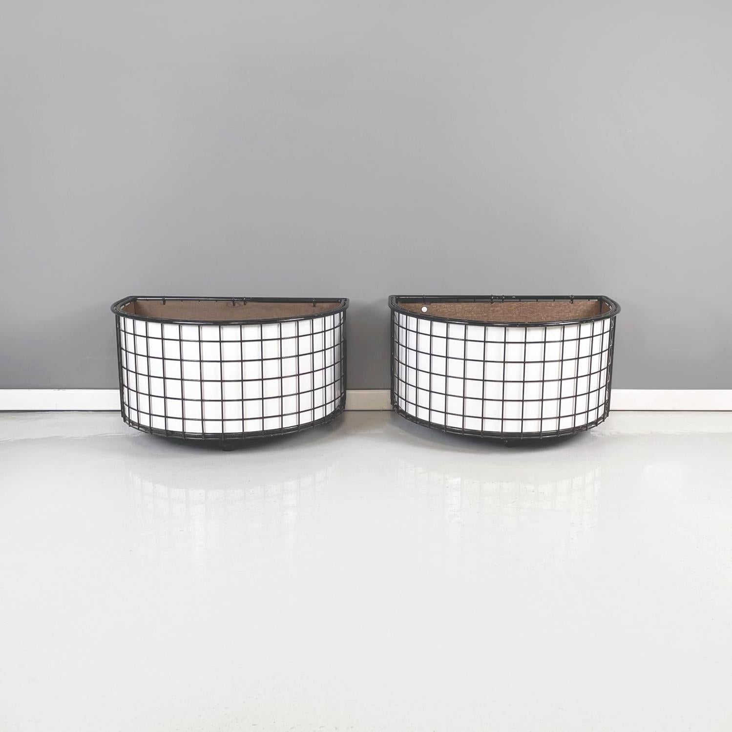 Italian modern planters in black metal, white wood and blue plastic, 1980s.
Pair of semi-oval base planters in metal, wood and plastic. The external structure is in black painted metal rod with white painted thin wooden panels. In the center there