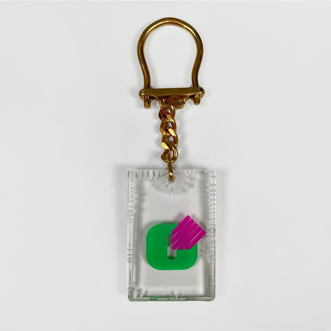 Italian modern plastic keychain for Olivetti, 1970s
Transparent plastic key ring. It has a chain with a gold-colored metal hook and a plastic pendant with logo. Complete with box.
Produced by Olivetti in 1970s.
Good condition, only the case shows