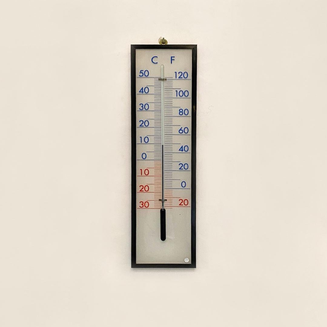 Italian modern plexiglass and glass mercury wall thermometer, 1980s

Old mercury thermometer for wall, 
Coming from an old doctor's office site in Milan Italy.
The thermometer have a rectangular frame in black and white plexiglass panel with