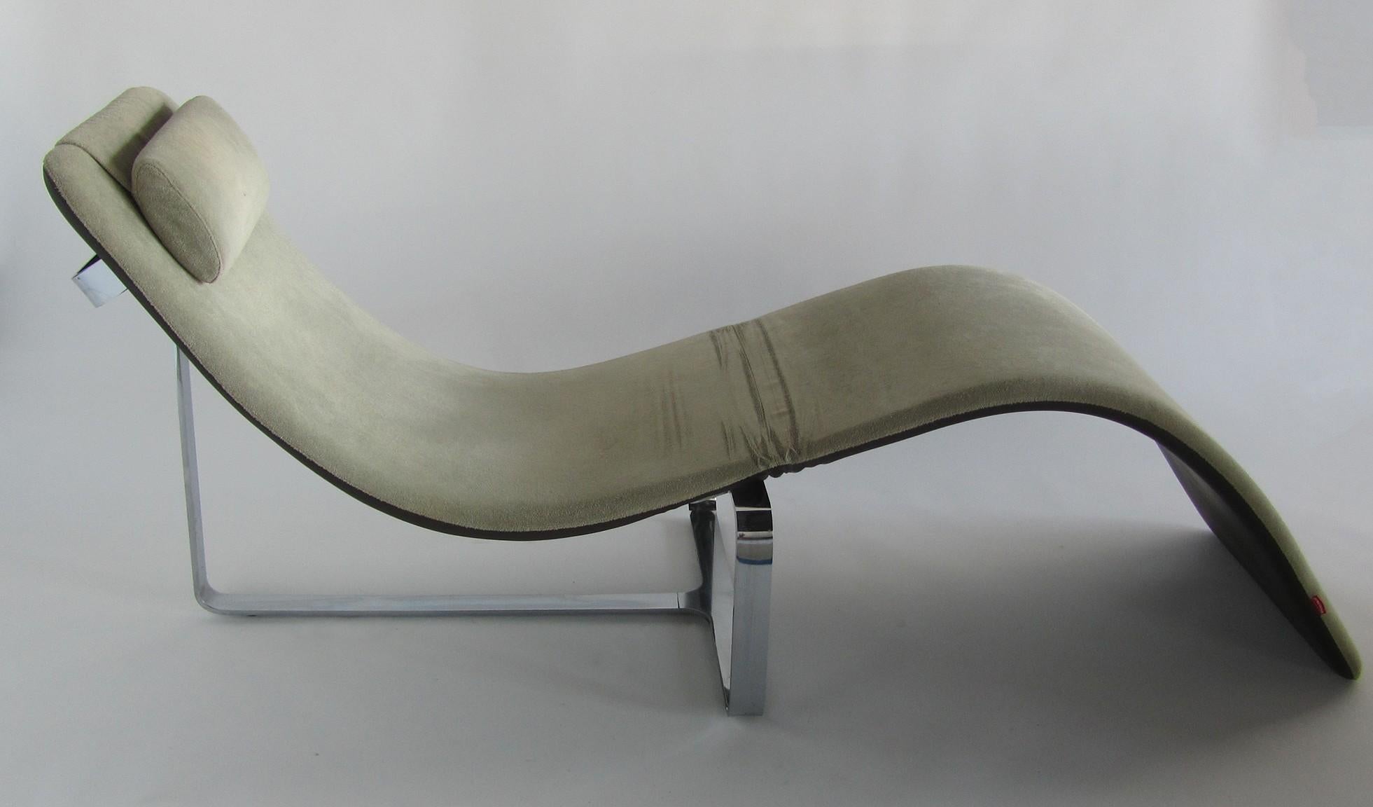 This is a unique piece. Closed it is chic lounge chair in supple leather, then it is a metamorphic chaise lounge with the fabric being a soft chenille. Produced by Baleri Italia and designed by Jeff Miller.