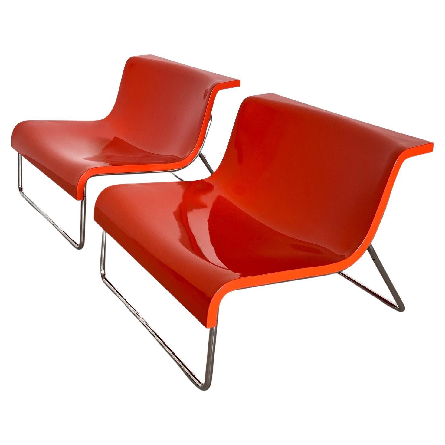 Beautiful set of two modern Lounge chairs designed by Piero Lissoni beginning 1970s for Kartell Italy. The chairs have an ergonomic shape and are extremely comfortable.
They are made of orange polyurethane foam with chrome-plated steel legs. The