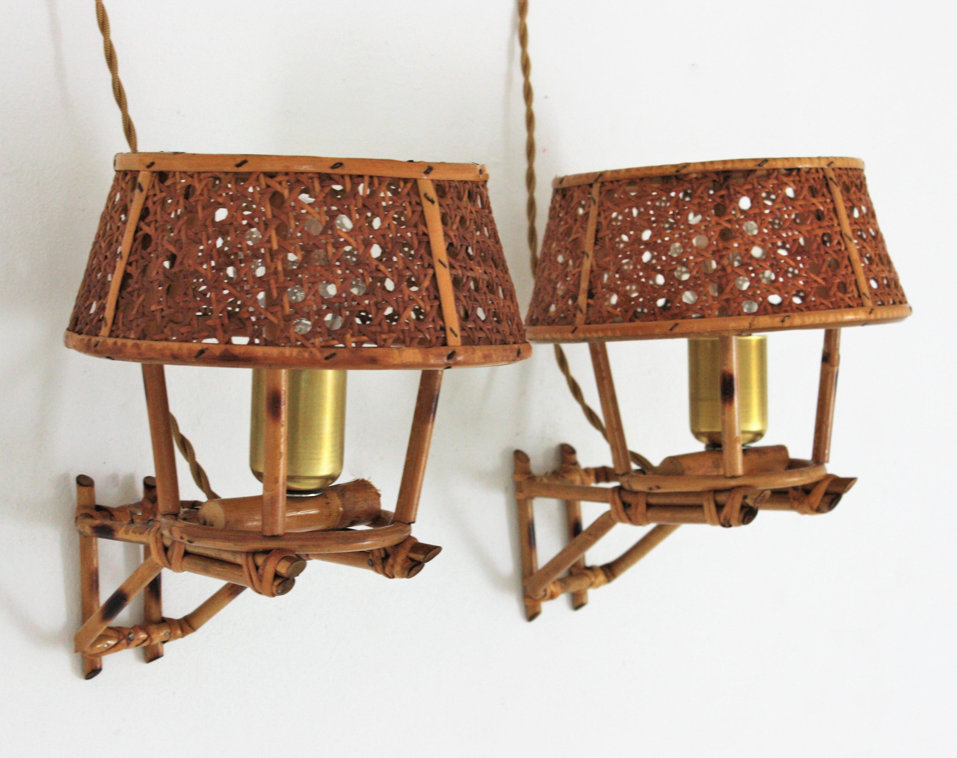 Eye-catching Mid-Century Modern rattan and cane wicker weave wall sconces. Italy, 1960s
These wall lights feature a rattan structure topped by a wicker wire lampshade.
They will be the perfect choice to add a modernist but fresh accent to any