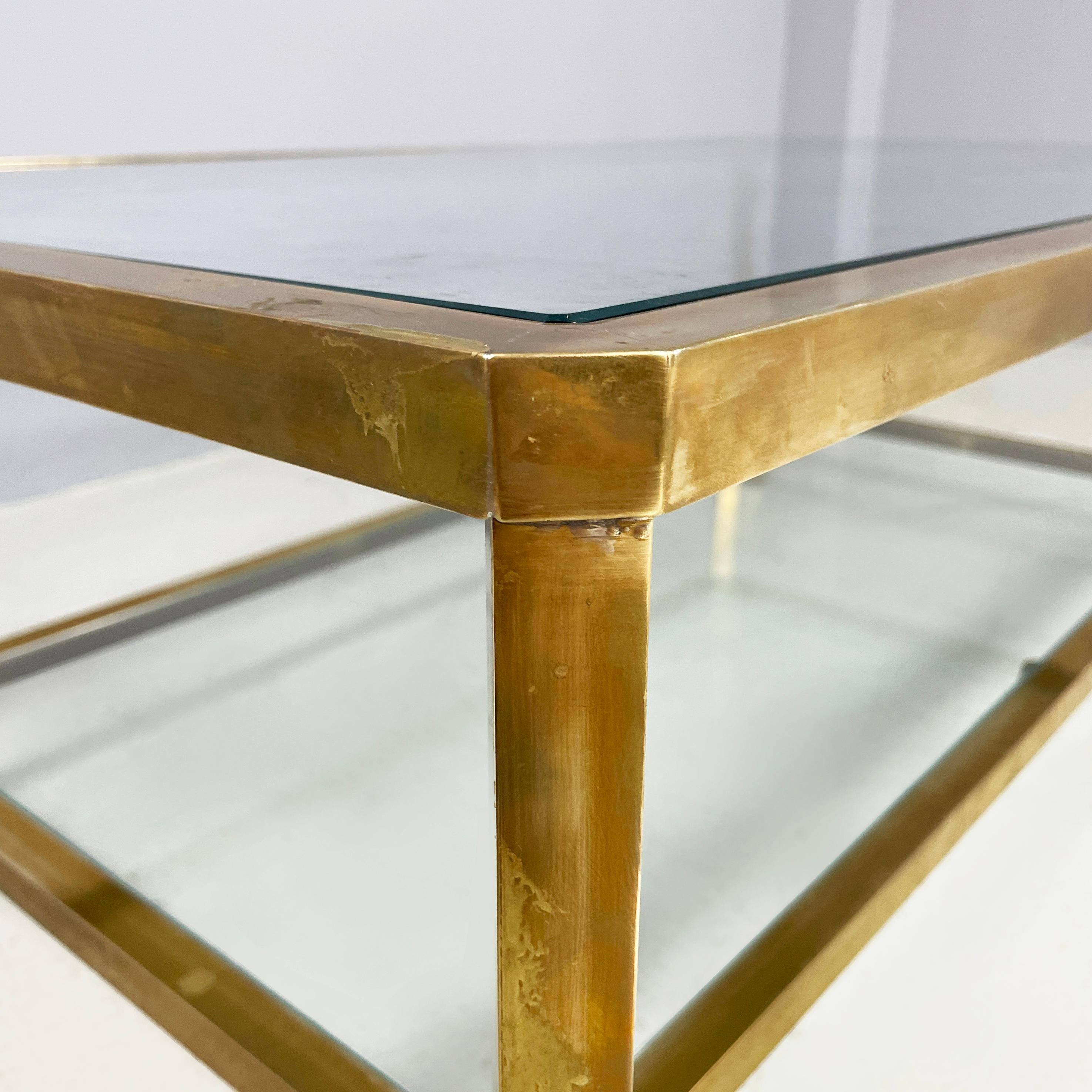 Late 20th Century Italian modern Rectangular coffee table with 2 shelves in brass and glass, 1970s
