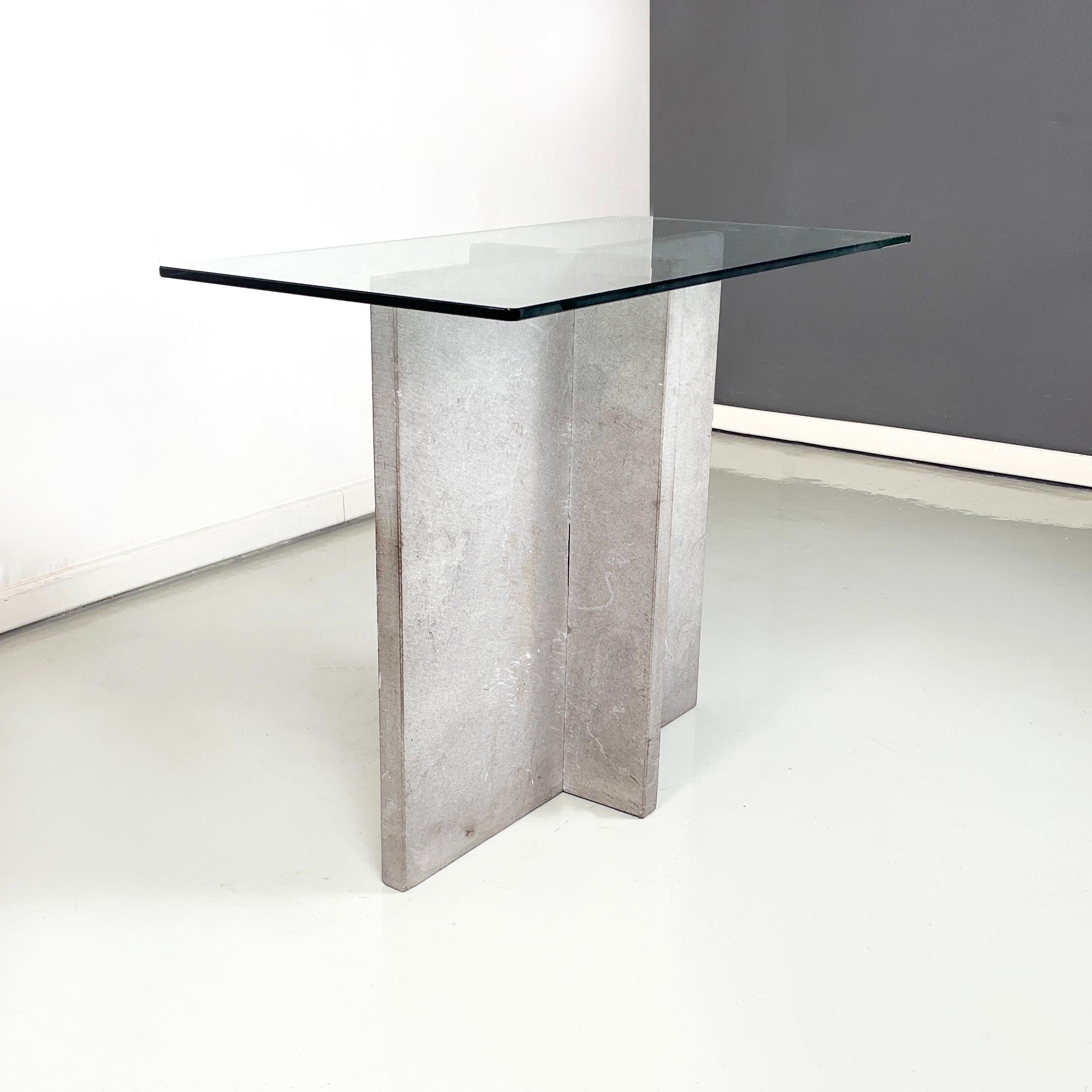 Italian modern rectangular Console in glass and cement, 1980s
Console table with rectangular top with rounded glass corners. The base is made up of two interlocking cement slabs, which form a cross.
1980 approx.
Good condition, the glass and
