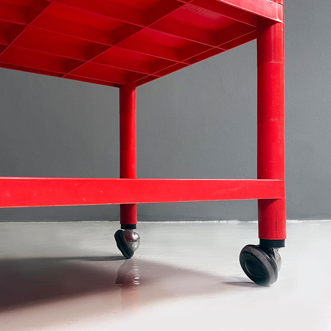 Italian modern red plastic trolley with three shelves and wheels, 1980s 3