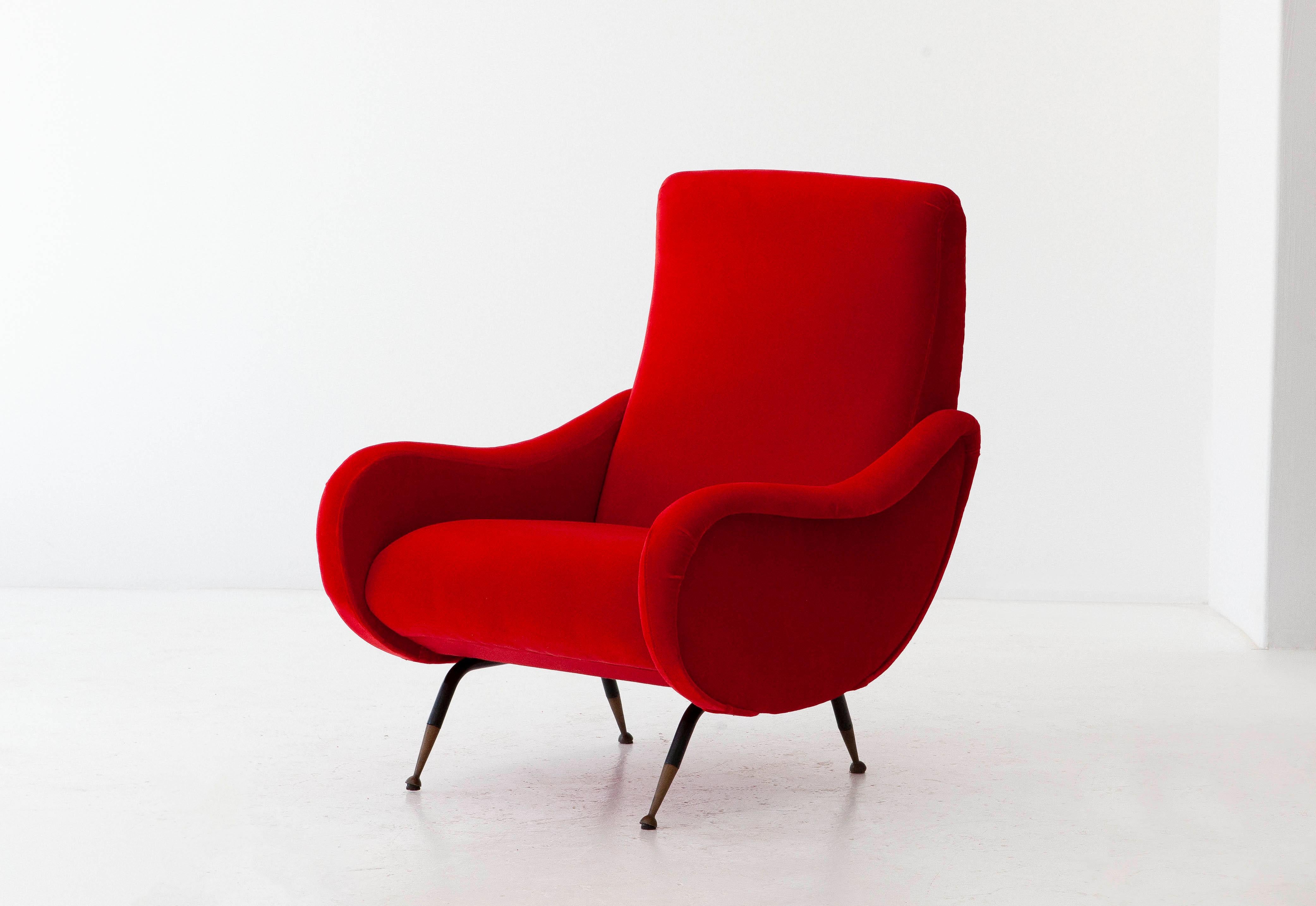 This Italian lounge chair was produced during the 1950s
Black enameled iron frame with brass socks
Fully restored:
new red cotton velvet upholstery and padding
The legs have been painted with new black, only the brass has original patina (a