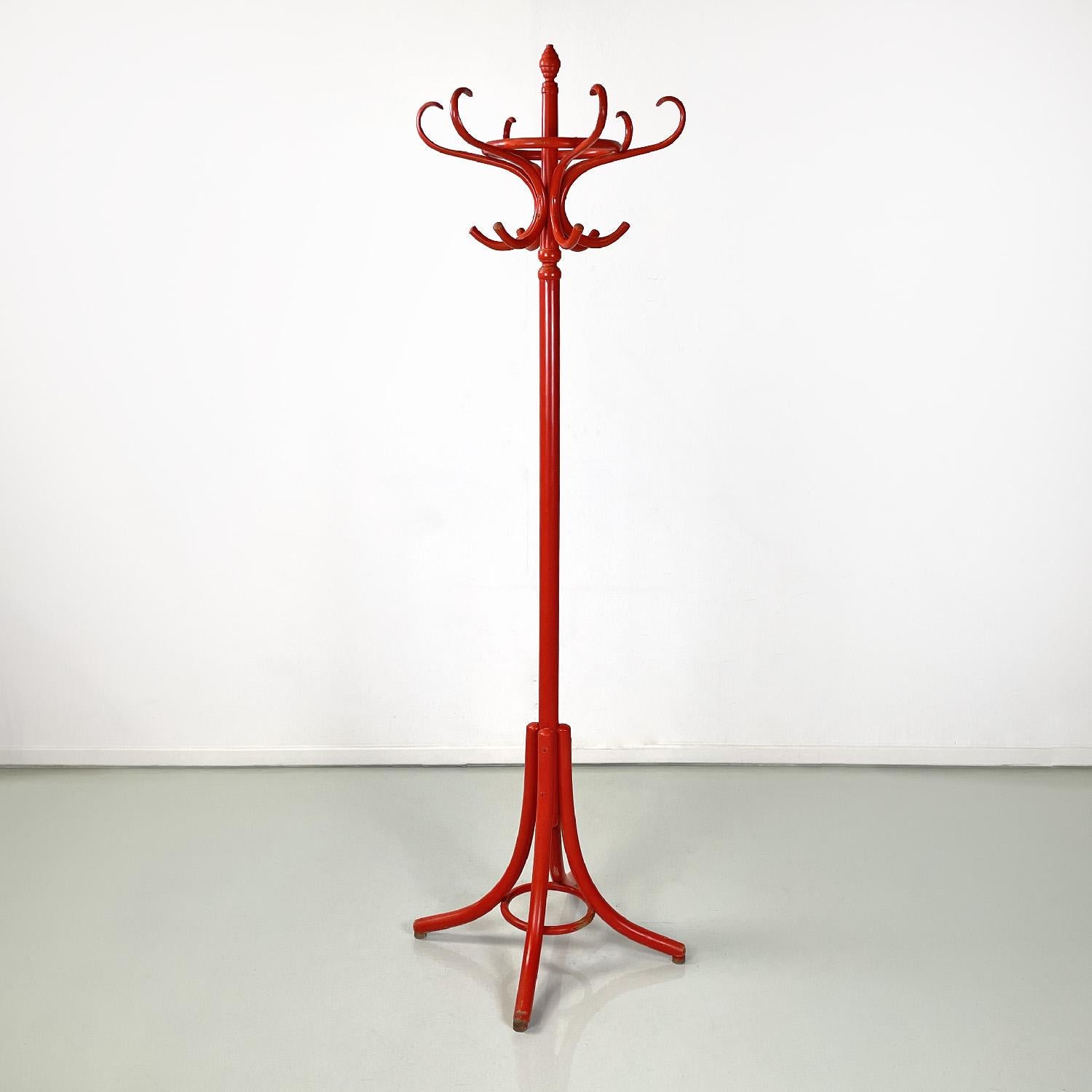 Italian modern red wooden floor coat hanger, 1970s
Floor coat hanger in red lacquered wood. It has a central knob and six coat hooks which have a 