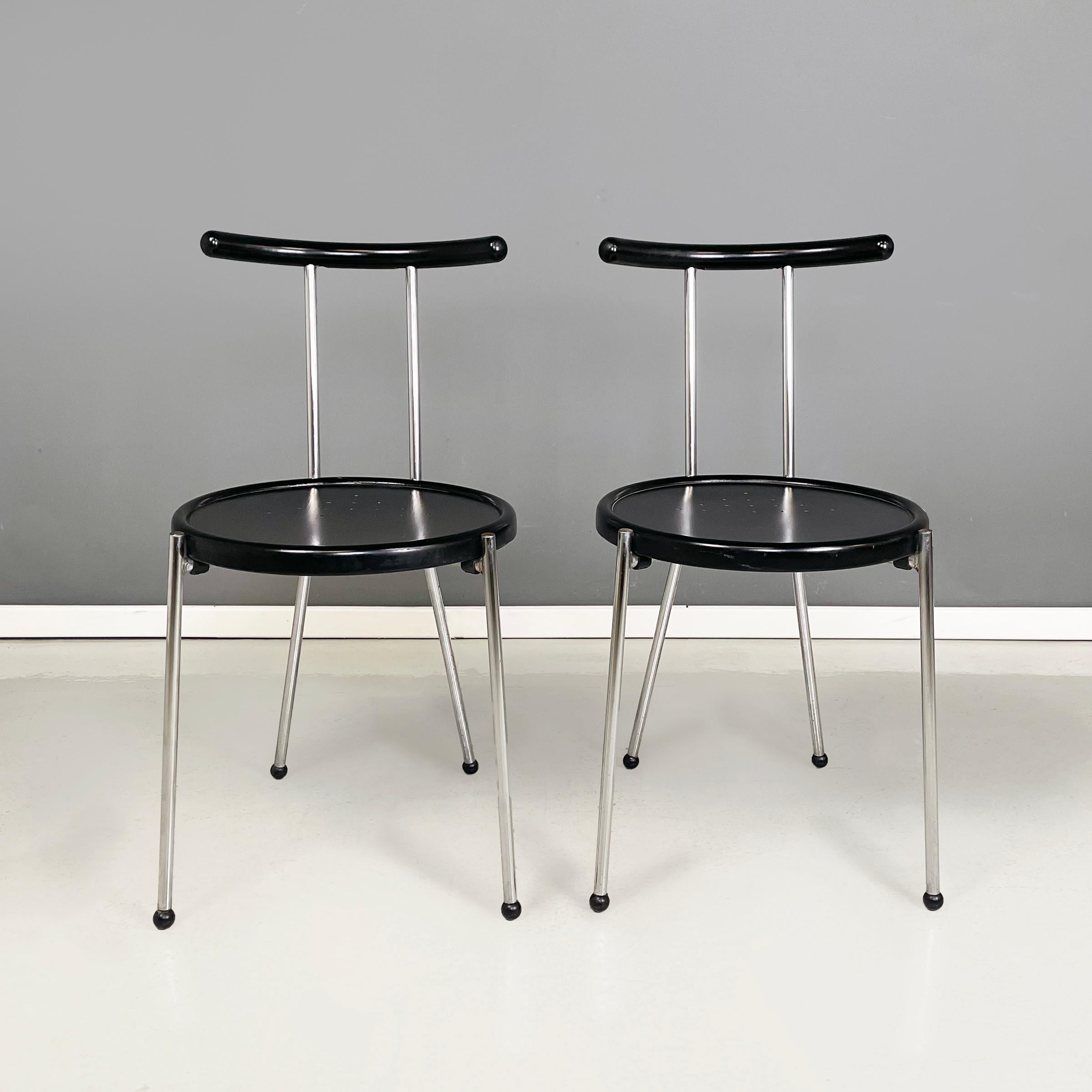 Italian modern round Chairs in black wood and metal rod, 1980s
Pair of chairs with round perforated seat in black painted wood. Curved backrest in black painted wood with metal rod structure. Metal rod legs with black spherical feet.
They are from