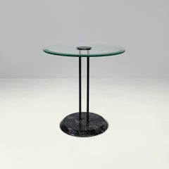 Italian modern round coffee table with glass top and black marble base, 1980s