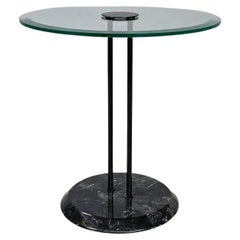 Italian modern round coffee table with glass top and black marble base, 1980s