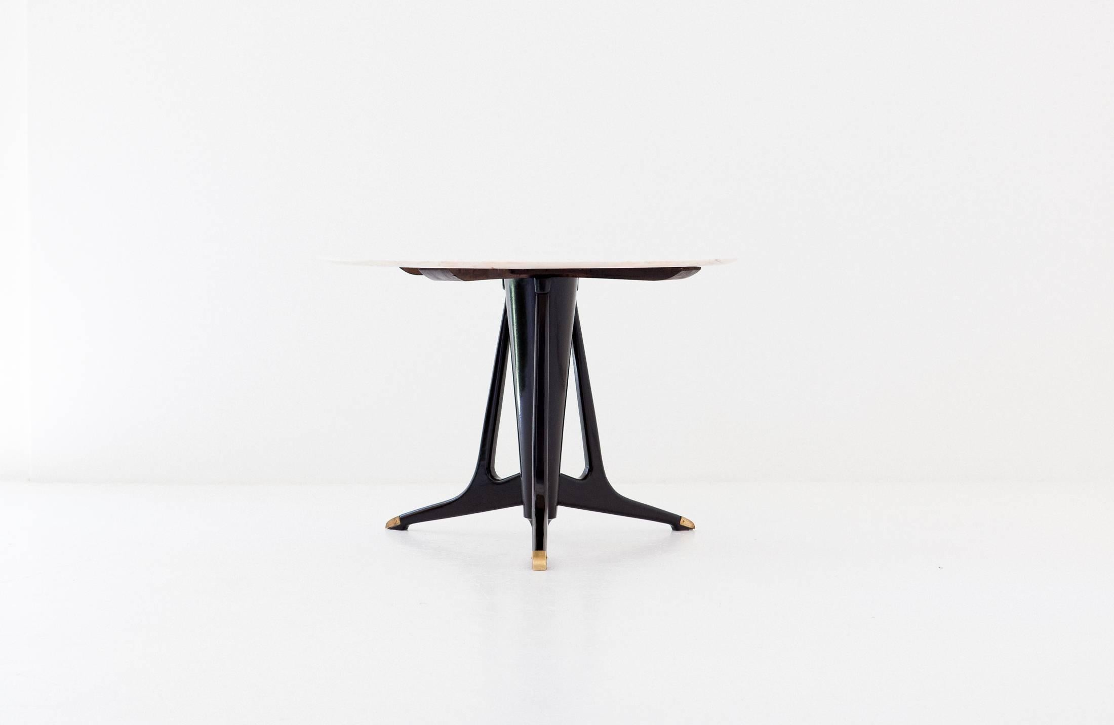 A round dining table manufactured in Italy in 1950s.
Marble top, black hand polished wooden legs with brass teeth
Completely restored, only the brass has the original patina
The designer is not known but the style recalls the hand of Osvaldo