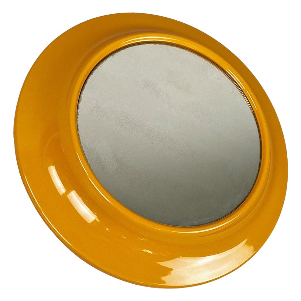 Italian modern round ocher yellow plastic mirror by Cattaneo Italy, 1980s