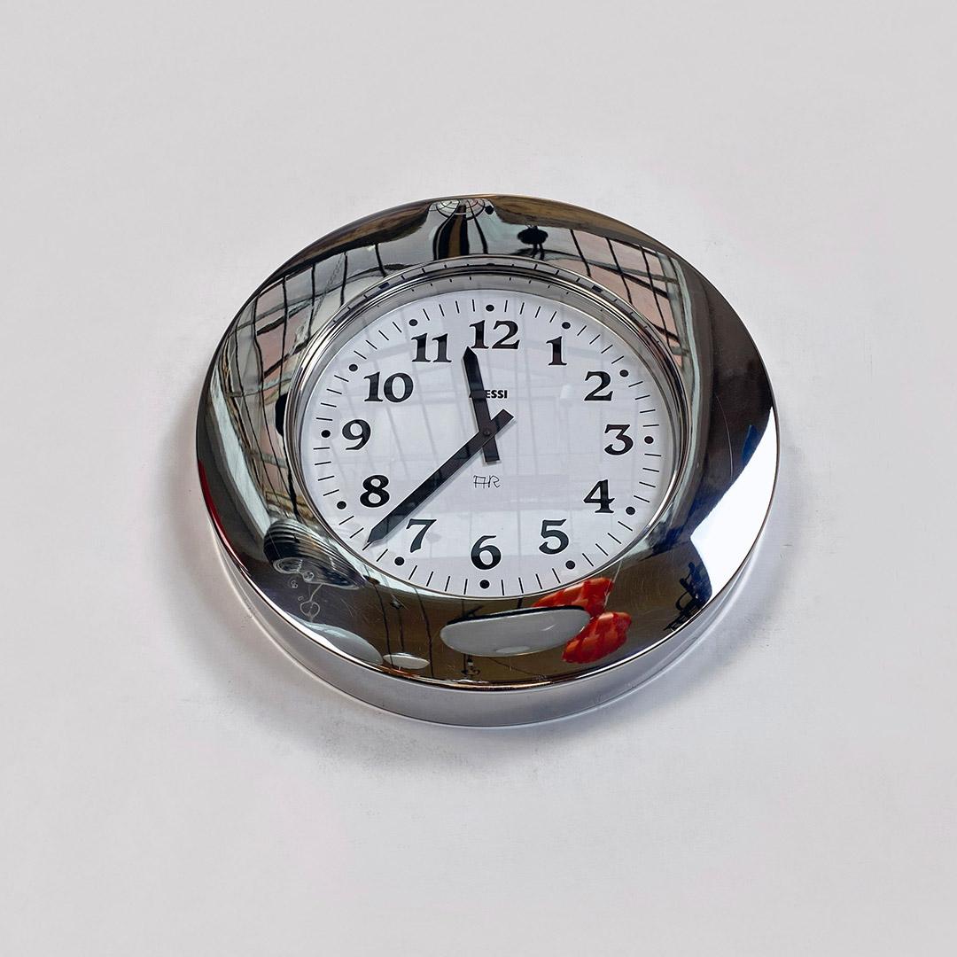 Italian modern round stainless steel wall clock with white dial by Alessi, 1980s
Round stainless steel wall clock with white dial and black numbers.
Made by Alessi in 1980s.
In good condition, it has a dent in the upper central part of the frame and