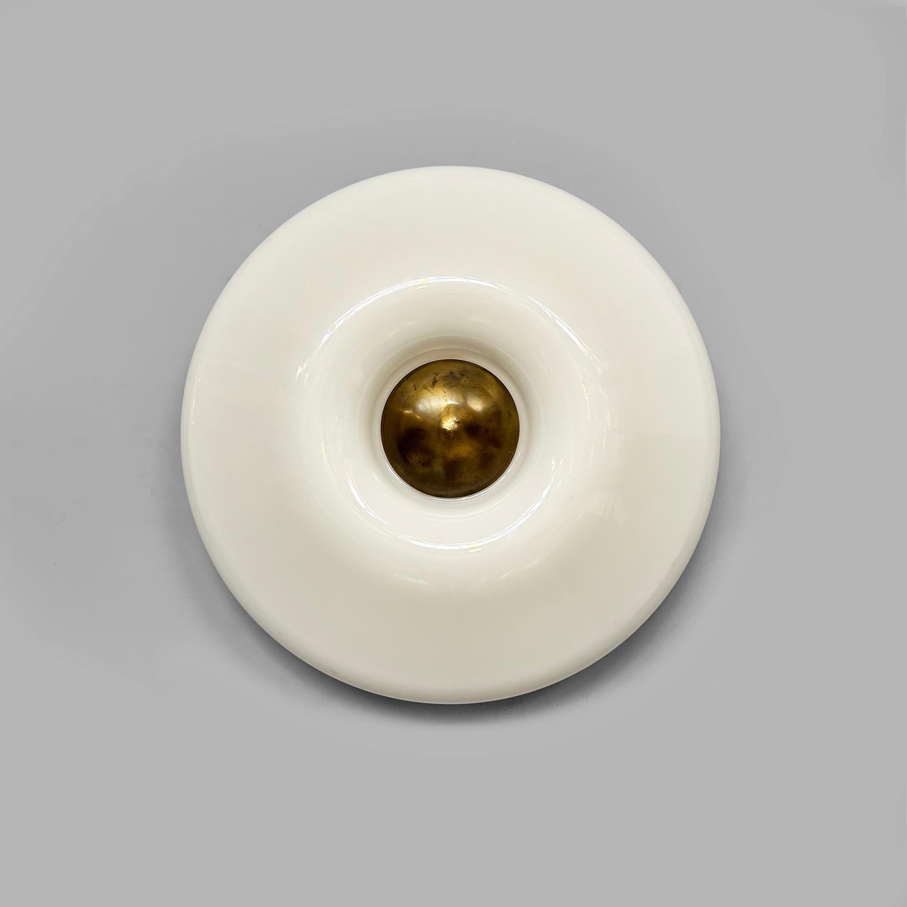 Italian modern round wall lamps in plastic and metal by Valenti, 1970s
Pair of round-based wall lamps with a milky white acrylic diffuser. A metal circle is featured in the center.
Produced by Valenti in 1970s. Logo label inside.
Good condition,