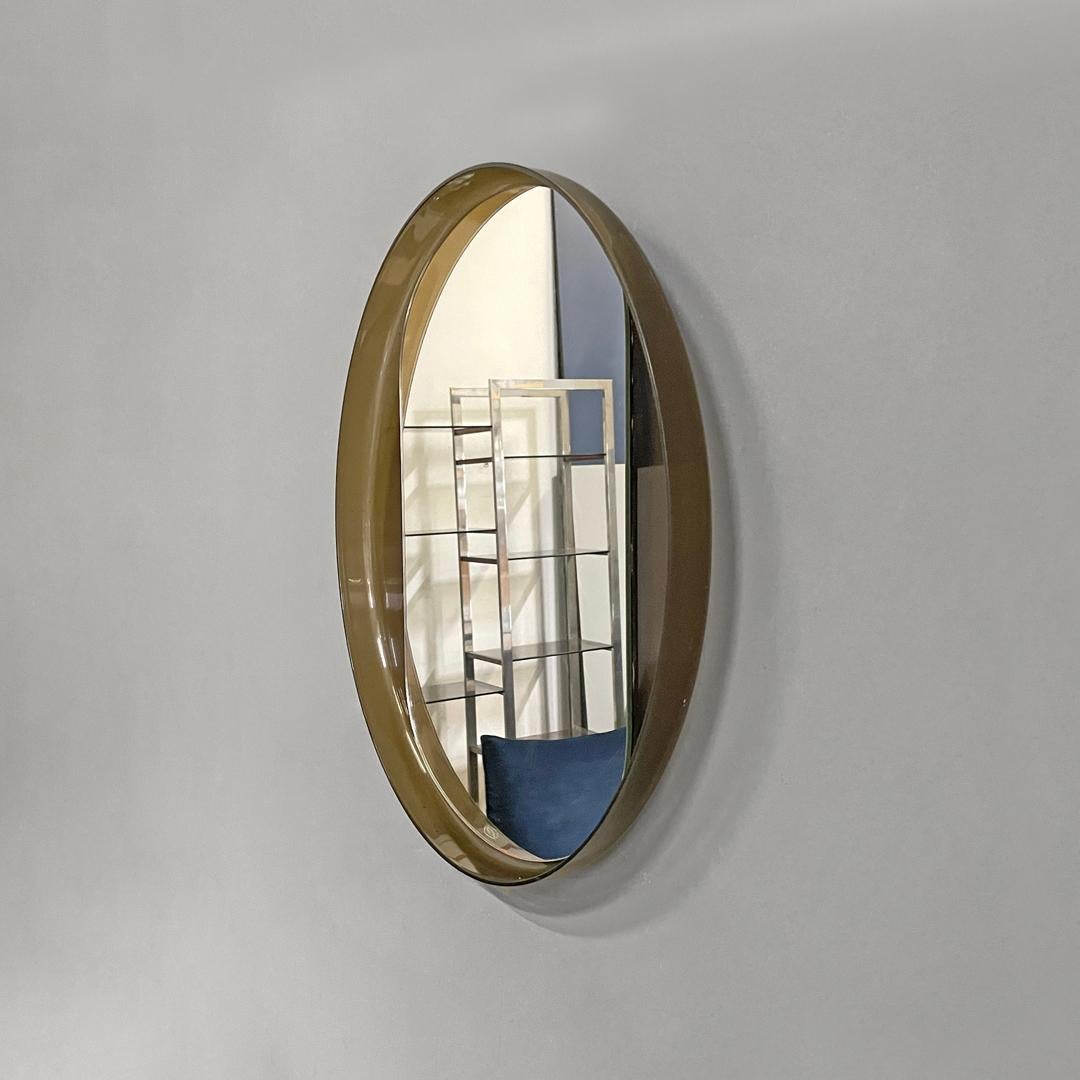 Mirror Italian modern round wall mirror in semitransparent brown plastic, 1970s 