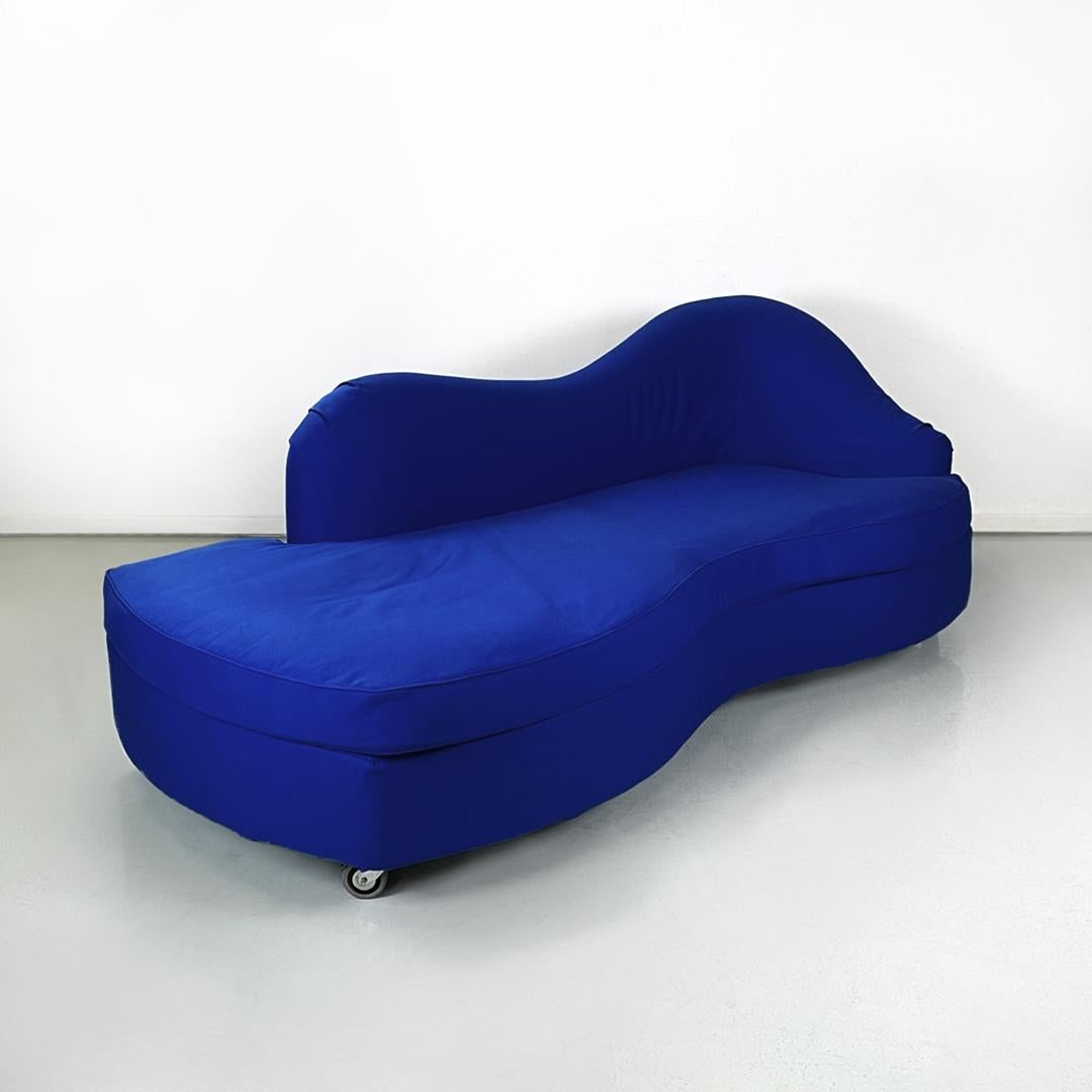 Italian modern rounded sofa in electric blue fabric by Maison Gilardino, 1990s
Three seater irregular rounded sofa, entirely upholstered and covered in electric blue fabric. The wavy line backrest has an armrest on one side. The seat also with a