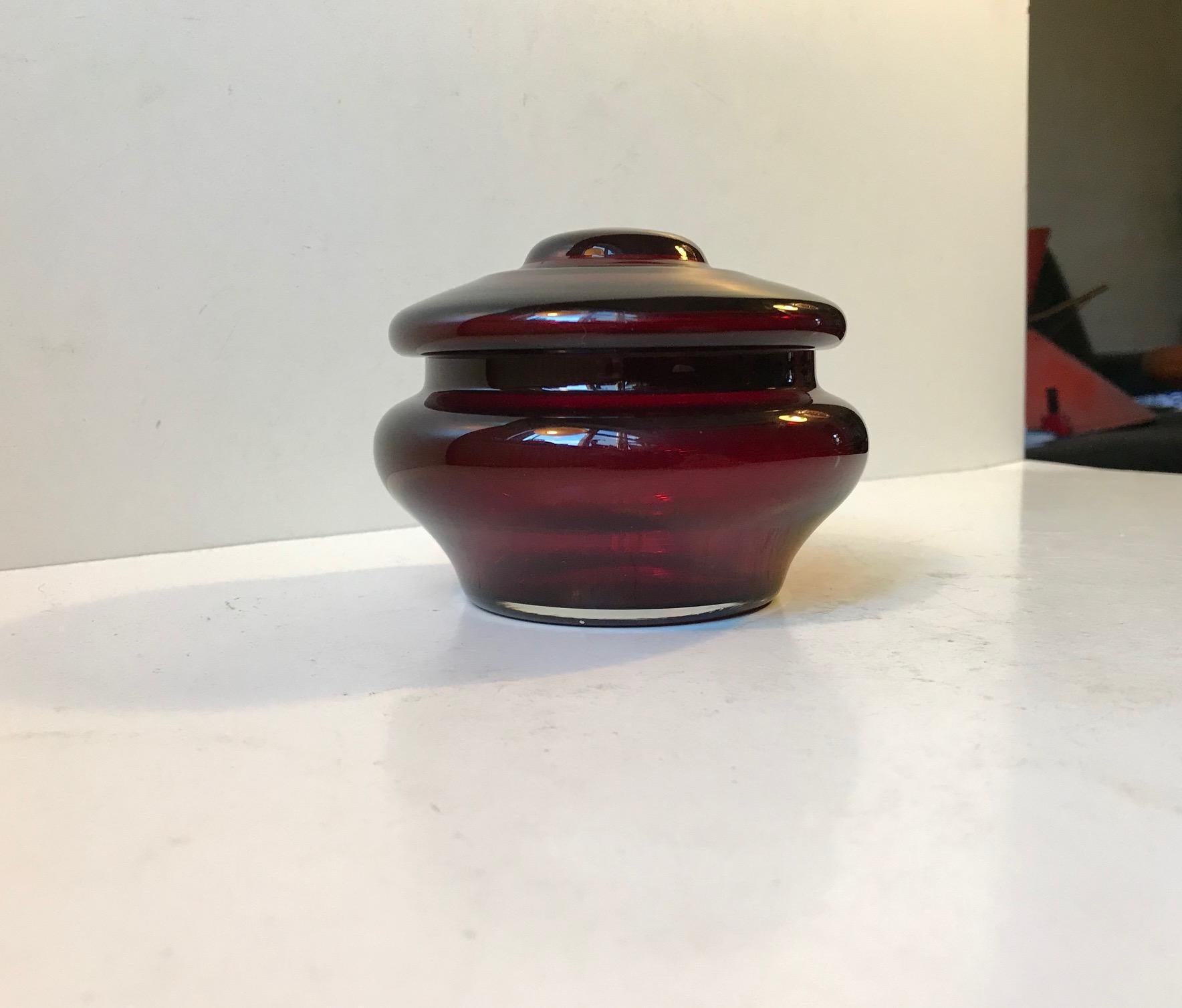 Organically shaped hand blown ruby red glass lidded jar or trinket from Empoli. Manufactured in Italy during the 1960s.