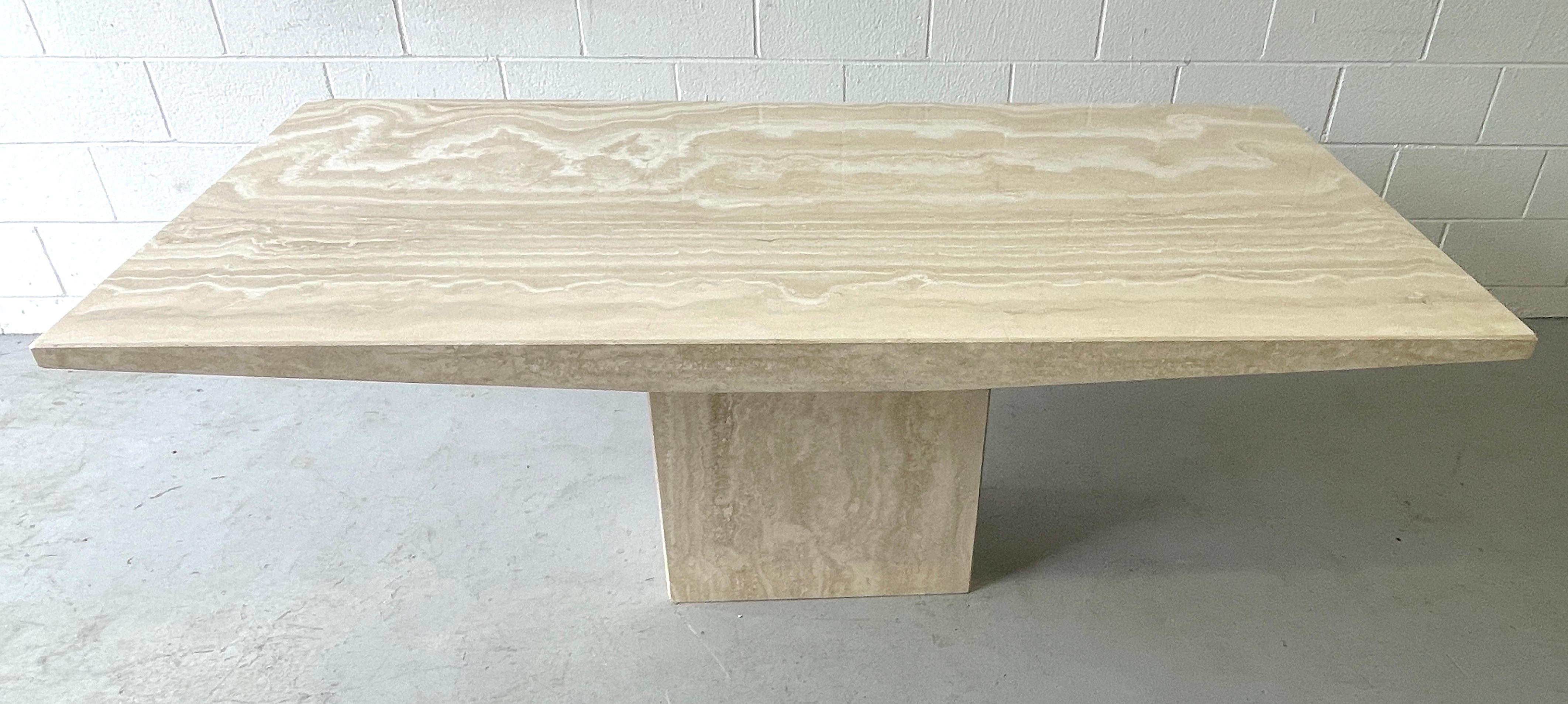 Italian Modern Sculptural Travertine Dinning Table
Italy, circa 1970s

An exceptional example of specimen quality variegated travertine, the subtle design detail of the descending slope of the side edges, add to the exceptional quality of this