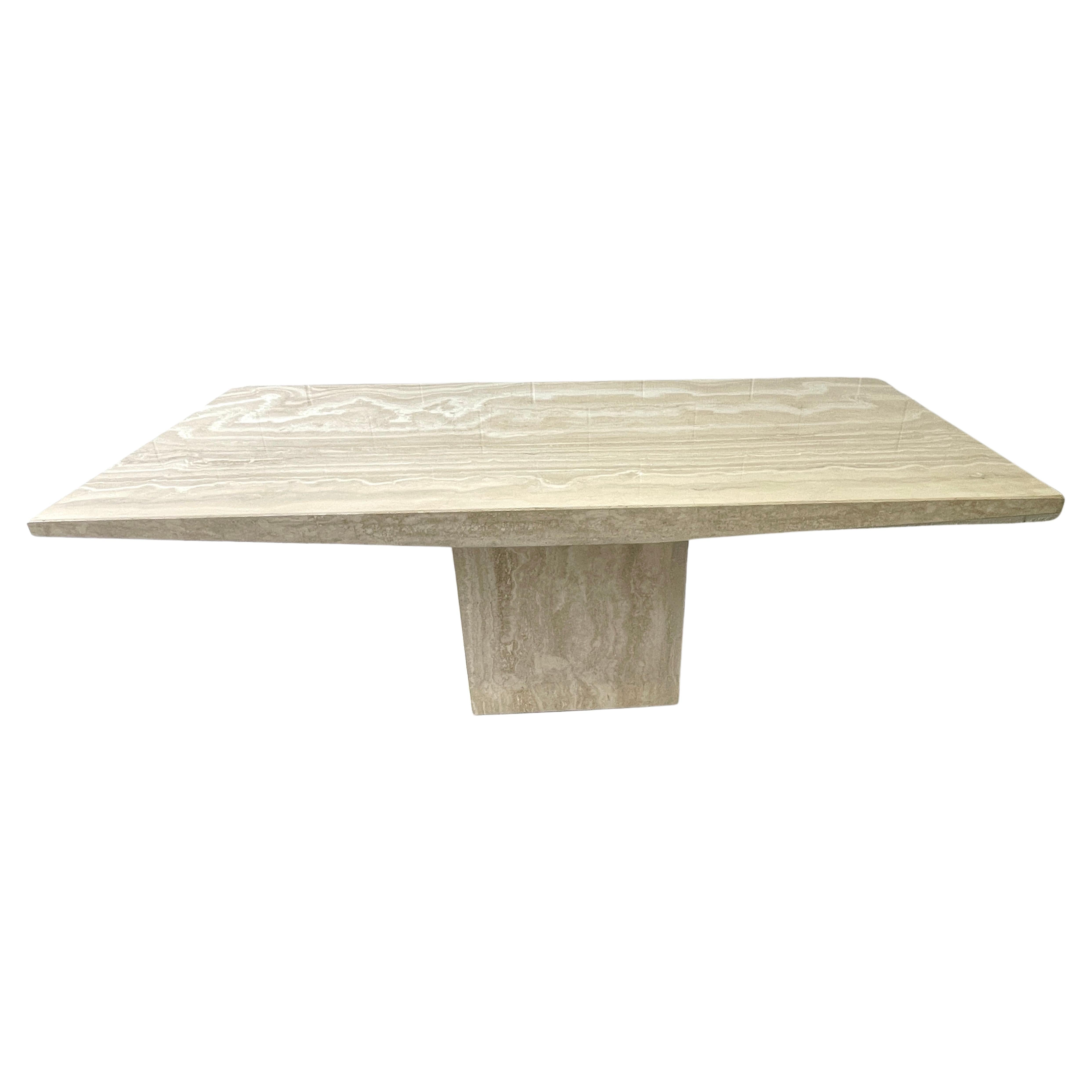 Table de salle à manger italienne moderne sculpturale en travertin