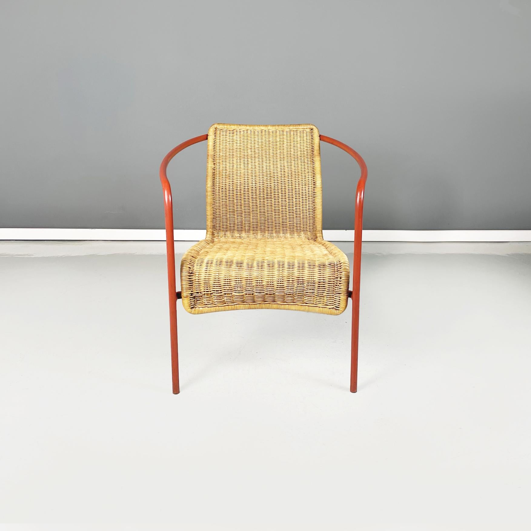 Italian modern Semi-oval outdoor armchair in rattan and orange tubular metal, 1980s
Semi-oval armchair in wicker and metal. The backrest and the long seat are in woven rattan. The structure is in orange painted tubular metal. Perfect for use on the