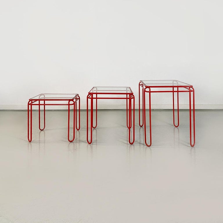 Italian modern set of three red metal and transparent glass coffee tables, 1980s
Set of three coffee tables with different dimensions, making the whole set stackable, to save space. Structures in double red metal rod and transparent glass