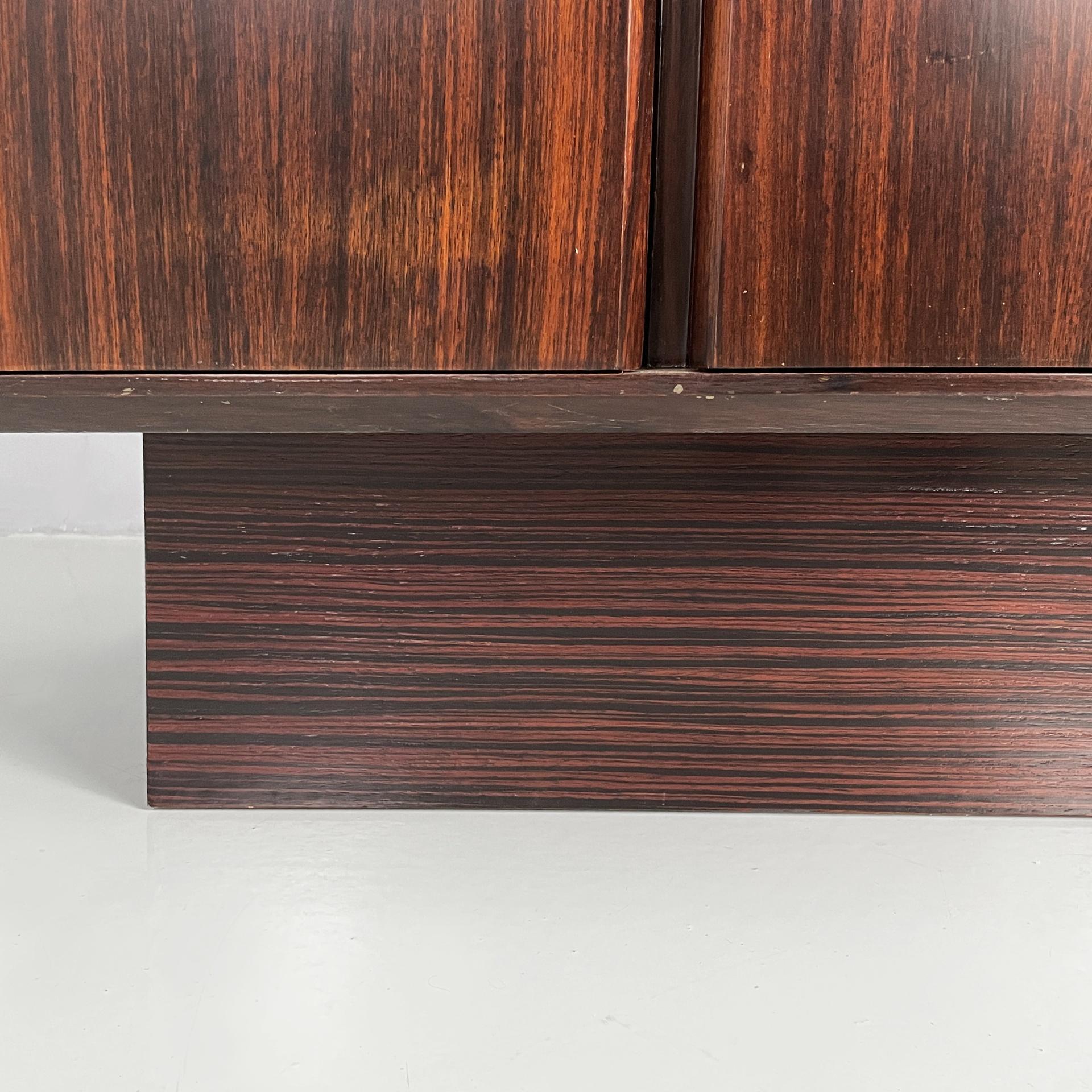 Italian modern sideboard in wood with hinged doors, shelves and drawers, 1970s For Sale 12