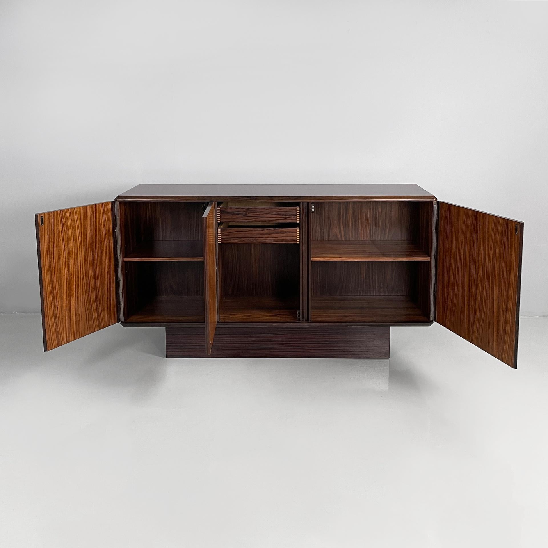 Modern Italian modern sideboard in wood with hinged doors, shelves and drawers, 1970s For Sale