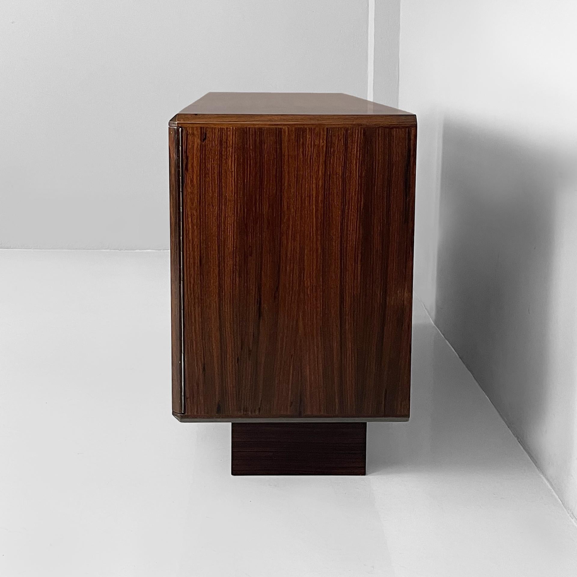 Italian modern sideboard in wood with hinged doors, shelves and drawers, 1970s In Good Condition For Sale In MIlano, IT