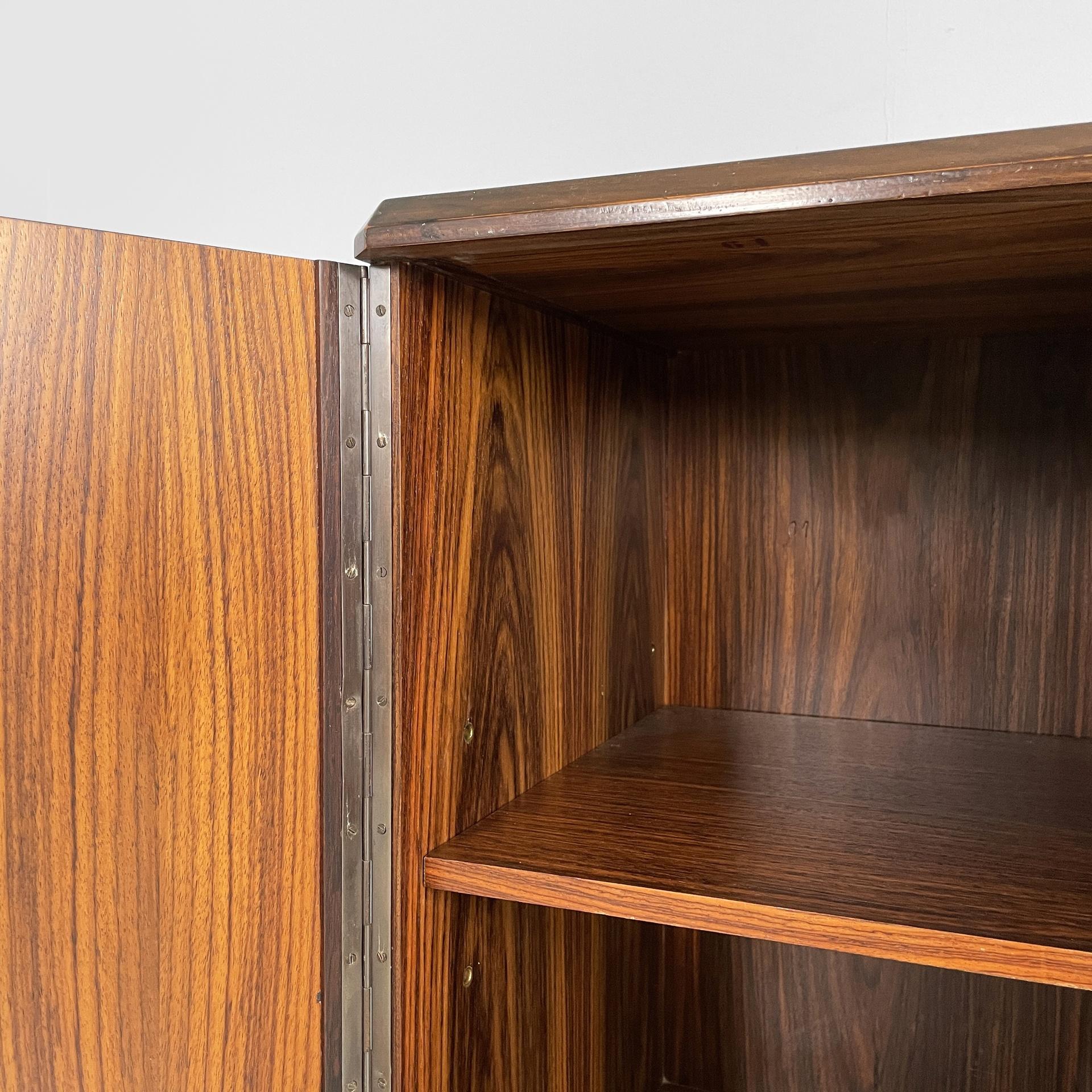 Wood Italian modern sideboard in wood with hinged doors, shelves and drawers, 1970s For Sale