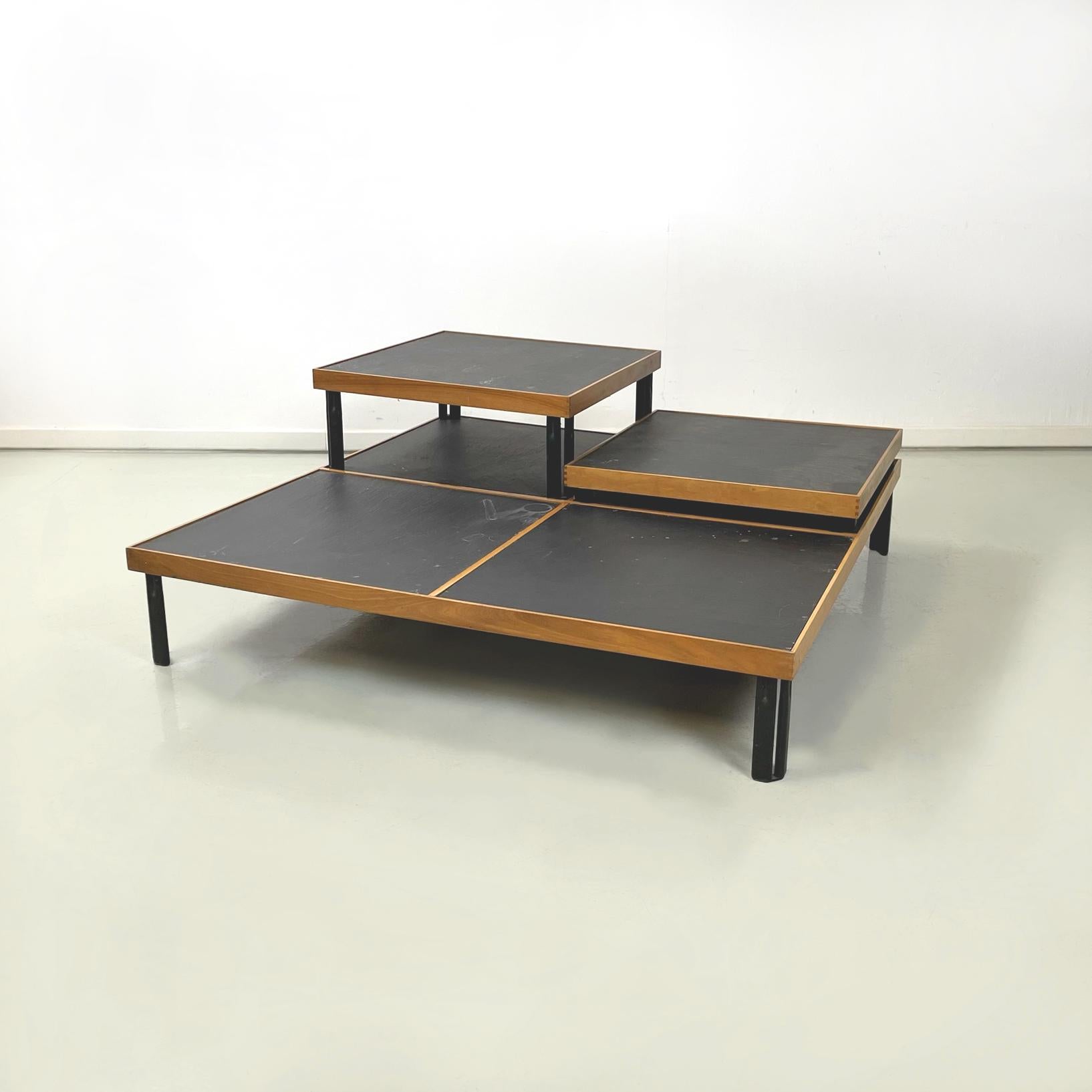 Italian modern Slate, wood and black metal Coffee tables by Piero De Martini for Cassina, 1980s
Set of 3 coffee tables with square top in wood and slate. The top of the two smaller tables have a wooden profile and a slate square in the centre, with