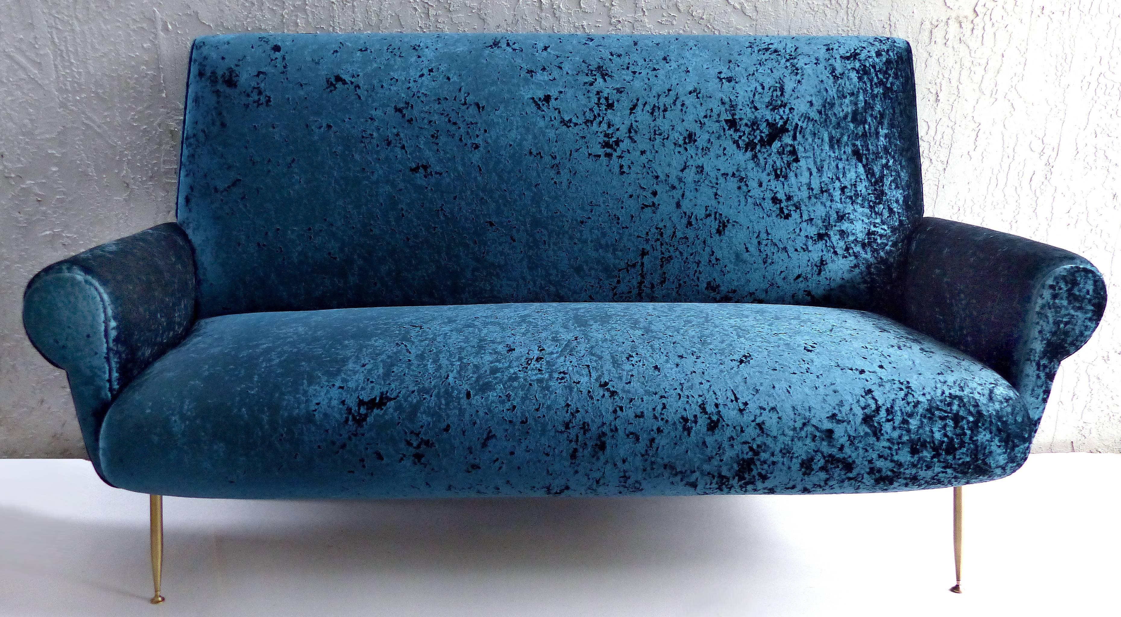 Offered for sale is a striking 1950s Italian modern sofa by Gigi Radice. The sofa has been newly upholstered in an unusual burn-out look velvet which is quite durable. The brass legs have been polished for a lovely contrast. Measures: Seat height,