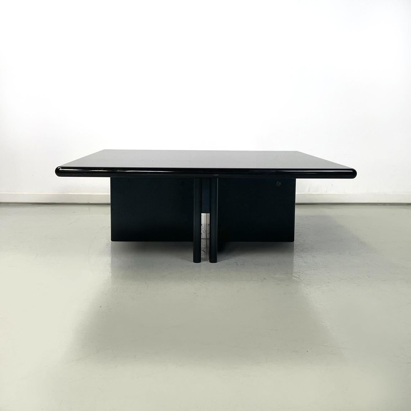 Italian modern squared coffee table in black lacquered wood, 1980s
Coffee table with square top and rounded corners, entirely in black lacquered wood. The legs are positioned crosswise and each one is made up of two vertical wooden