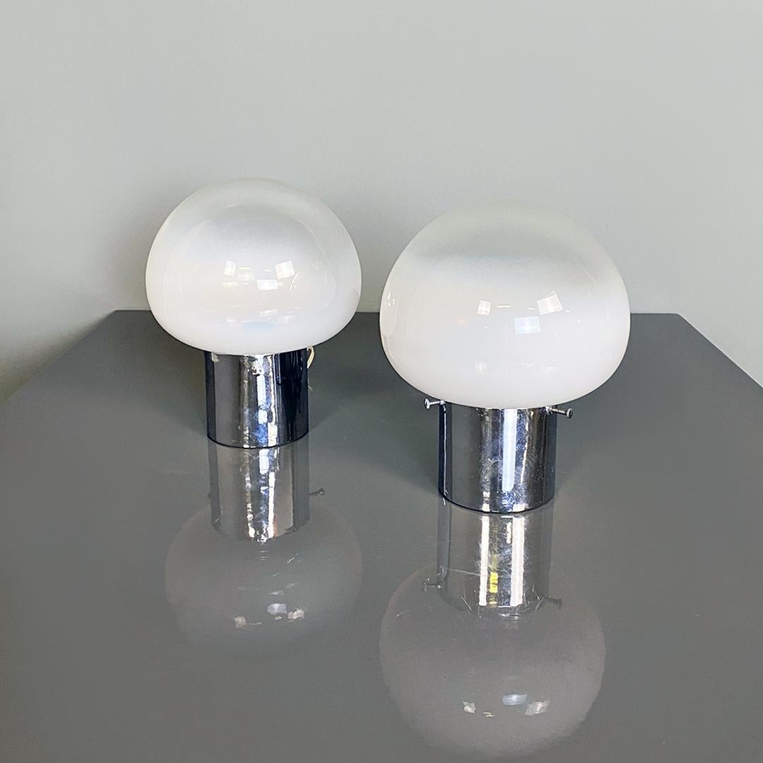 Italian modern steel and semi transparent glass bedside table, 1970s
Pair of bedside lamps with a cylindrical steel base containing the lamp holder and three screws which hold the diffuser in place. Glass with semi-transparent finish with white