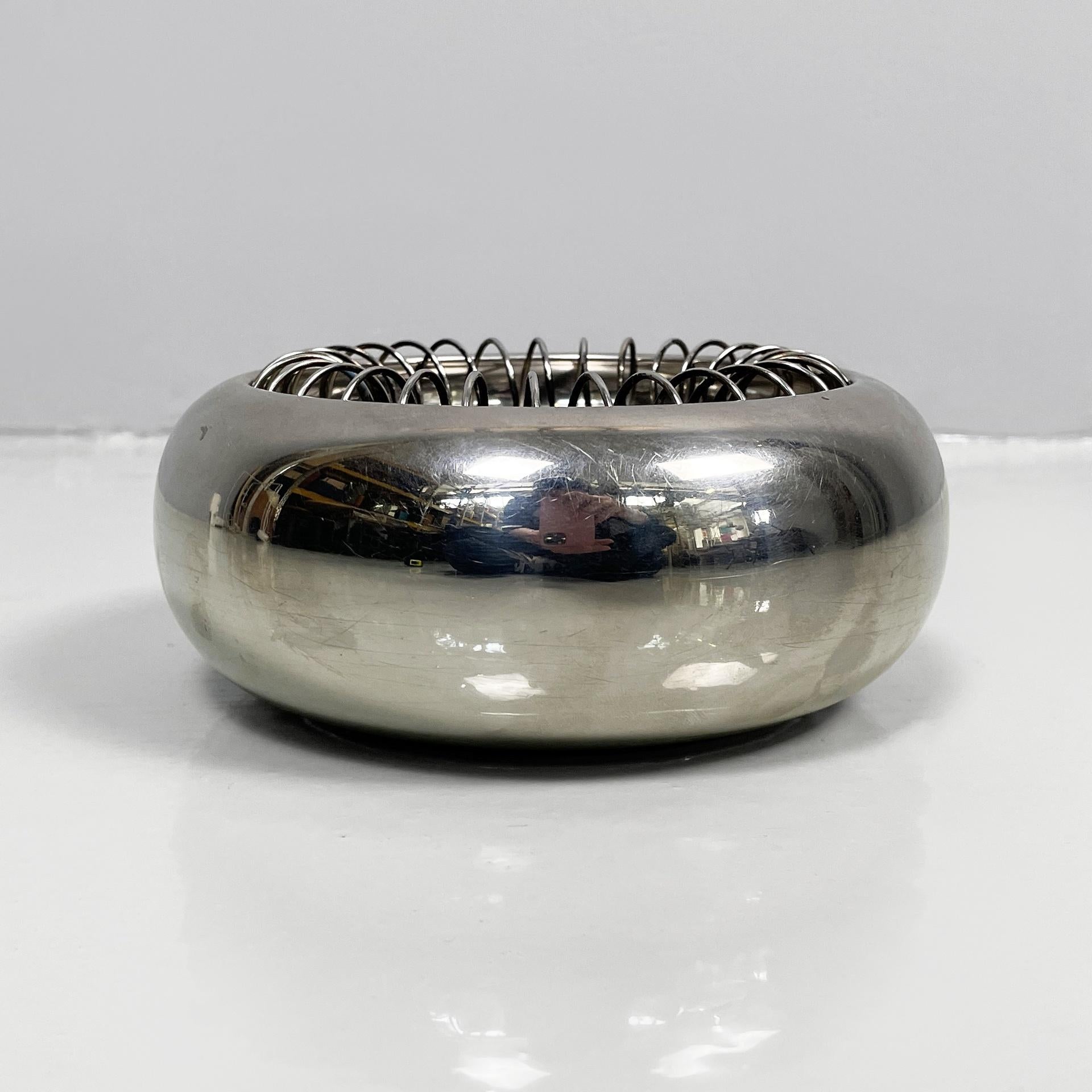 Italian modern steel ashtray Spirale by Achille Castiglioni for Alessi, 1990s
Ashtray model Spirale with round base in stainless steel. A spiral spring rests in the round plate, which can be used as a cigarette holder.
Produced by Alessi in 1990s